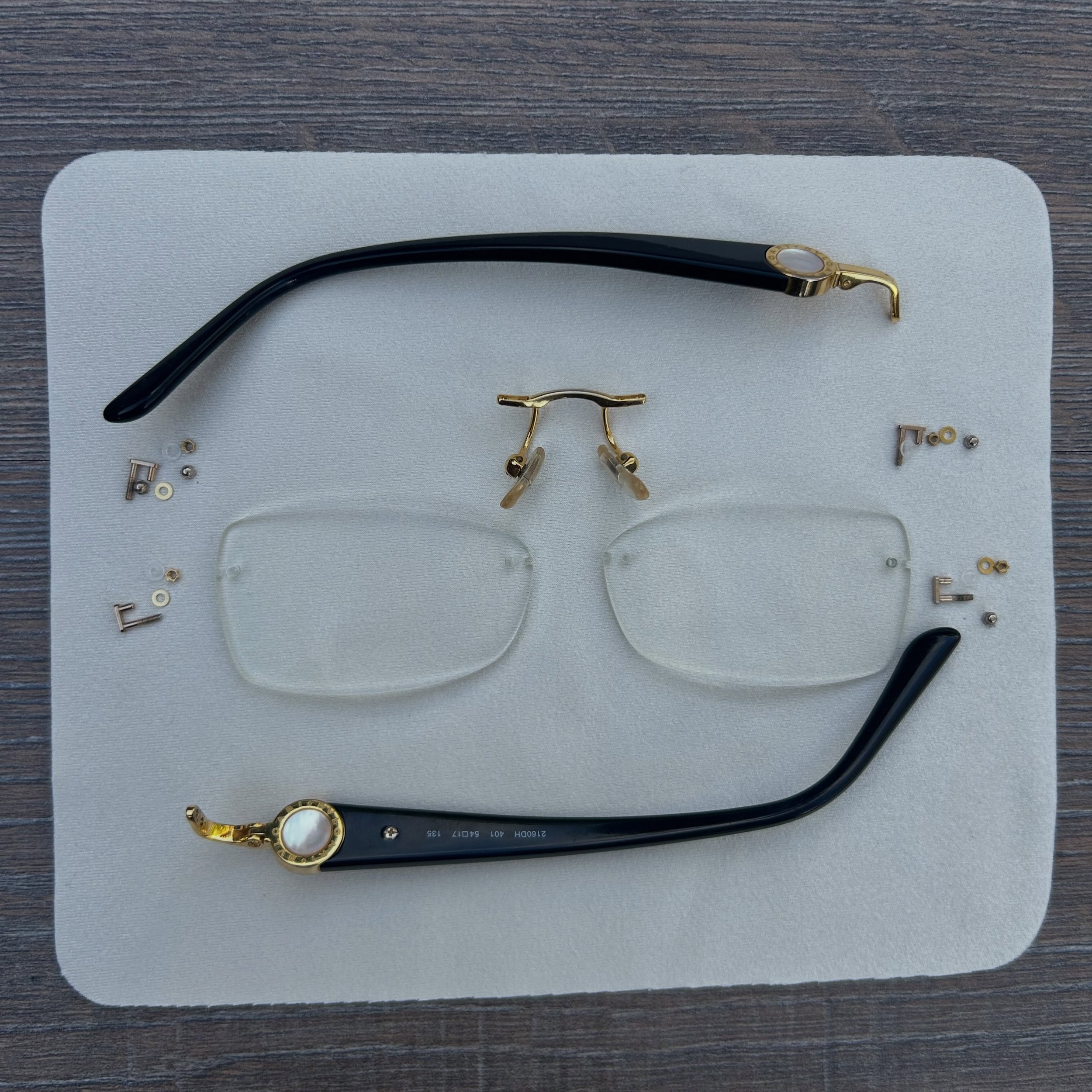 A complete strip down, clean and rebuild of this rimless Bvlgari frame.

Carefully reassembled, realigned and ready to wear again.