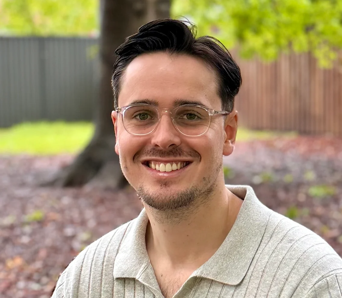 James Wightman, our psychologist at MindSure Psychology in Gosford on the Central Coast, sitting outdoors and smiling