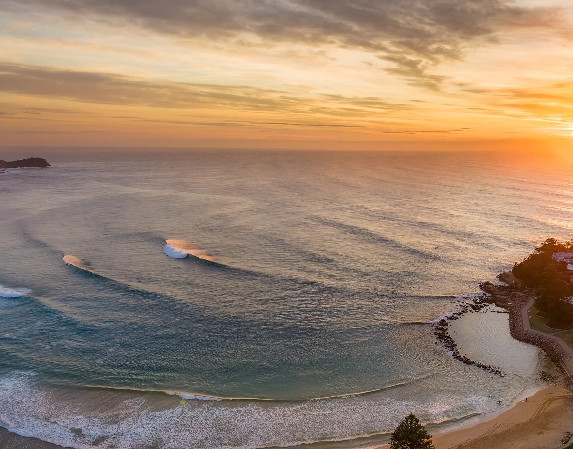 Avoca Beach sunrise view with clean rolling waves and golden light – Central Coast