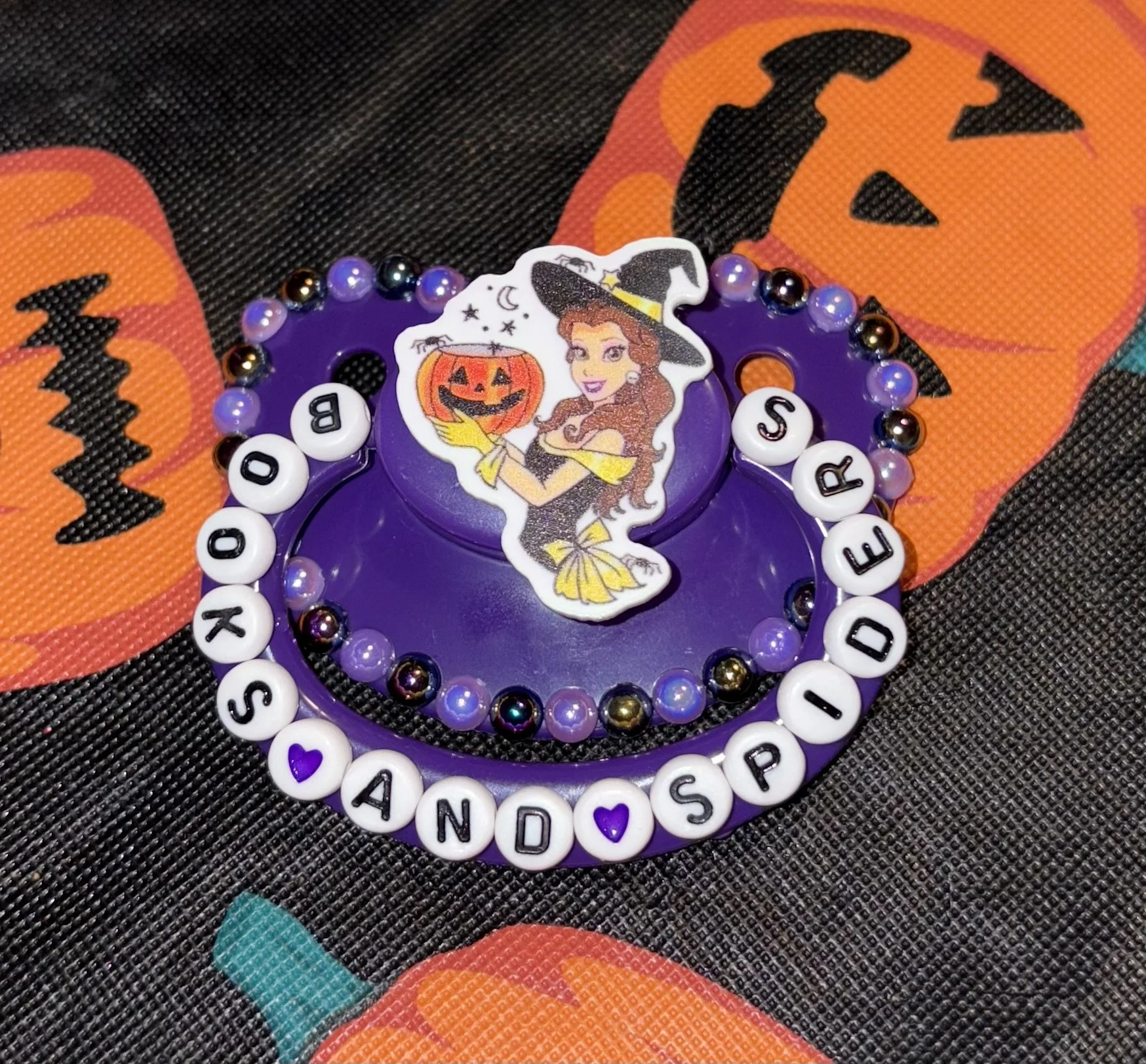 “Books and Spiders” Beauty Paci