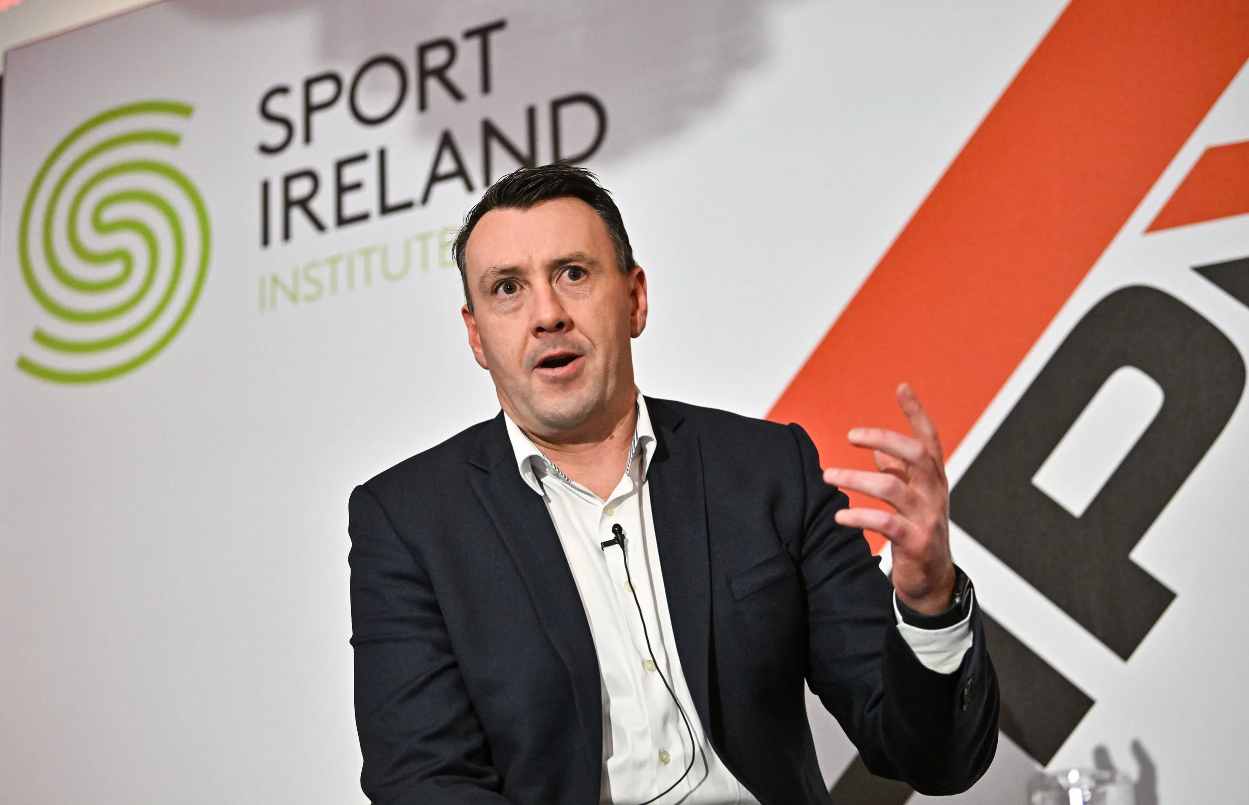 David O Siochain hosting Sport Ireland Institute panel pre Olympics interviewing David Nucifora about achieving high performance and driving sustained success.