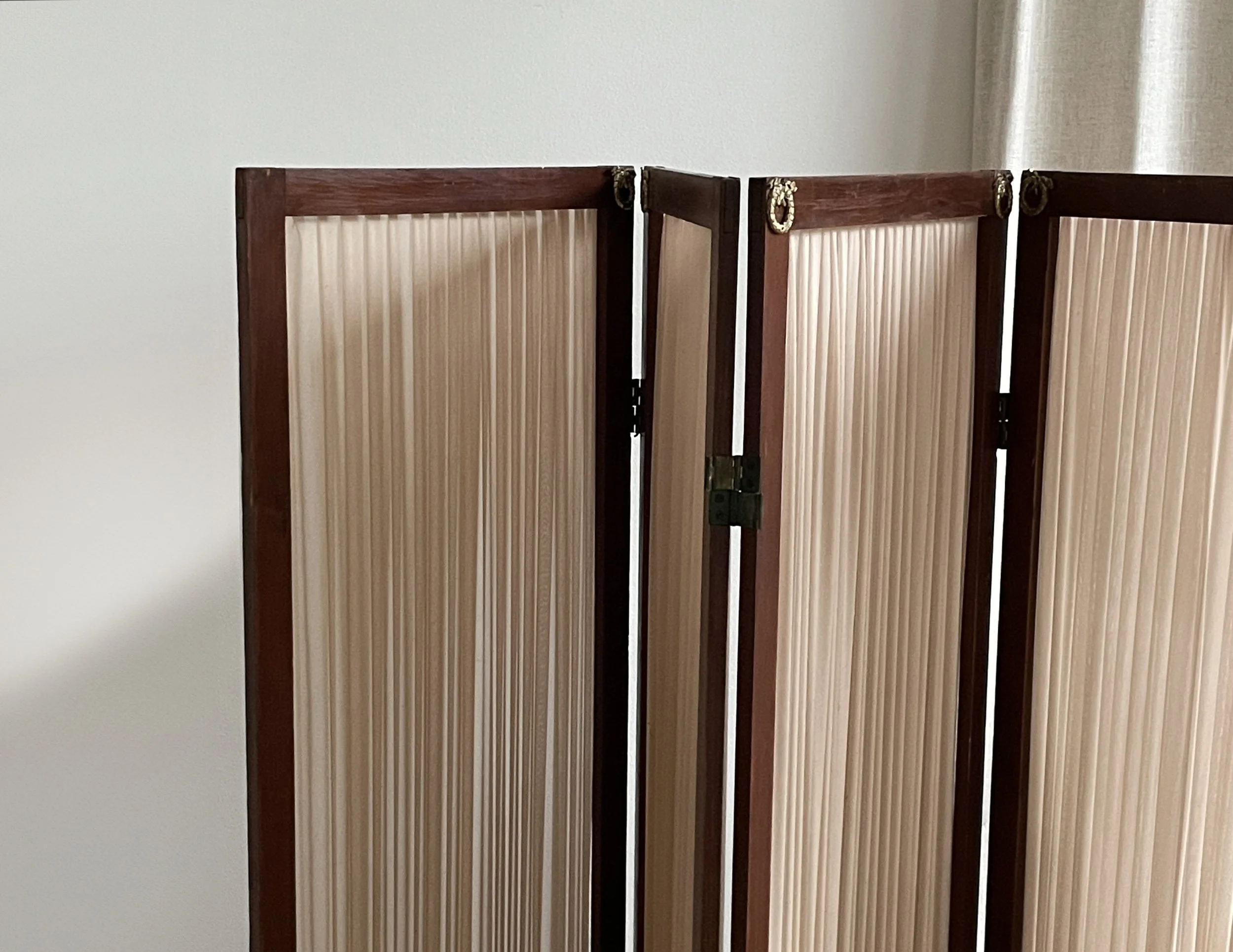 Room divider in stained wood with brass details