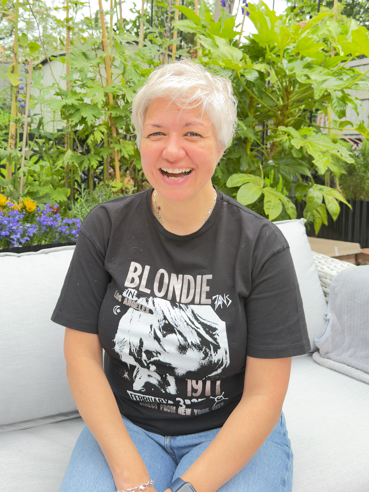 Dr Tanya Petersen smiling in the garden