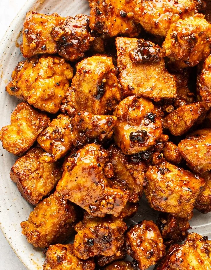 Golden-fried tofu glazed in a sweet, smoky barbecue-inspired sauce with Caribbean spice. Crispy on the outside, tender inside, and full of bold island flavor. Served with your choice of bases and sides.