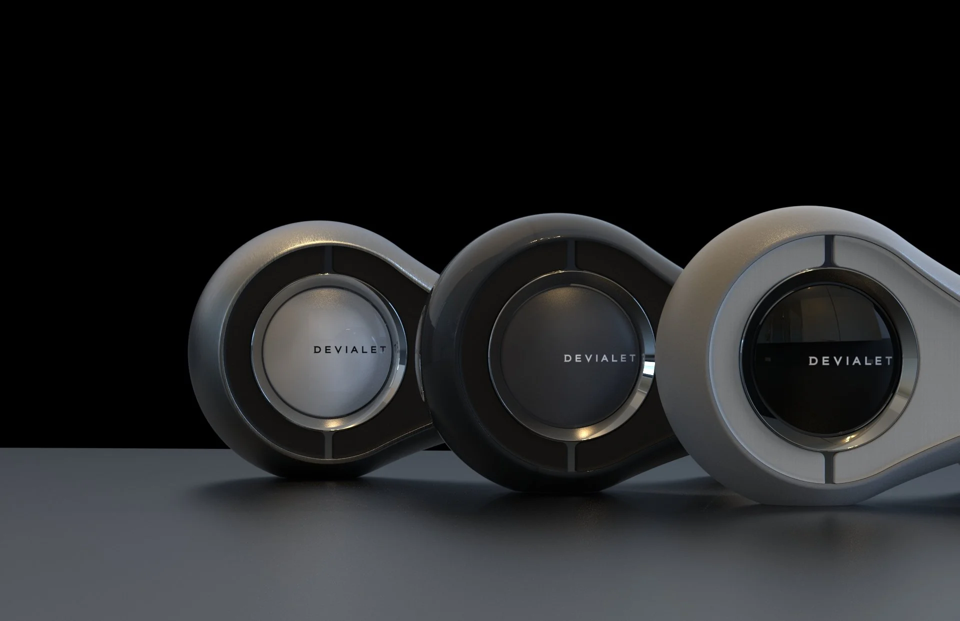 Three sleek, modern speakers with the brand name "Devalet" on the front, positioned side by side against a black background.