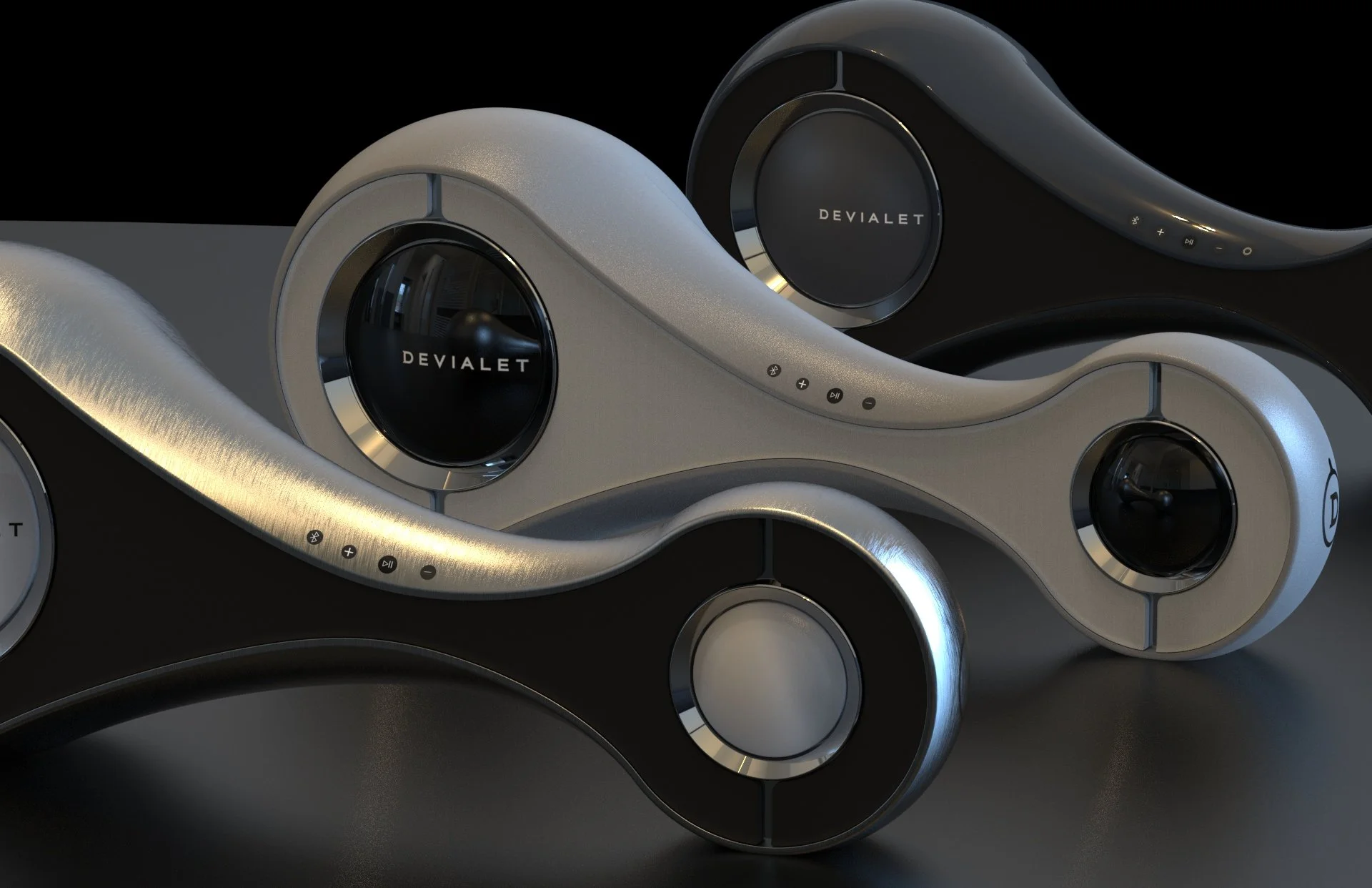 Close-up of two modern, sleek, metallic speaker systems with the brand name 'Devialet' on circular black speaker units, set against a dark background.