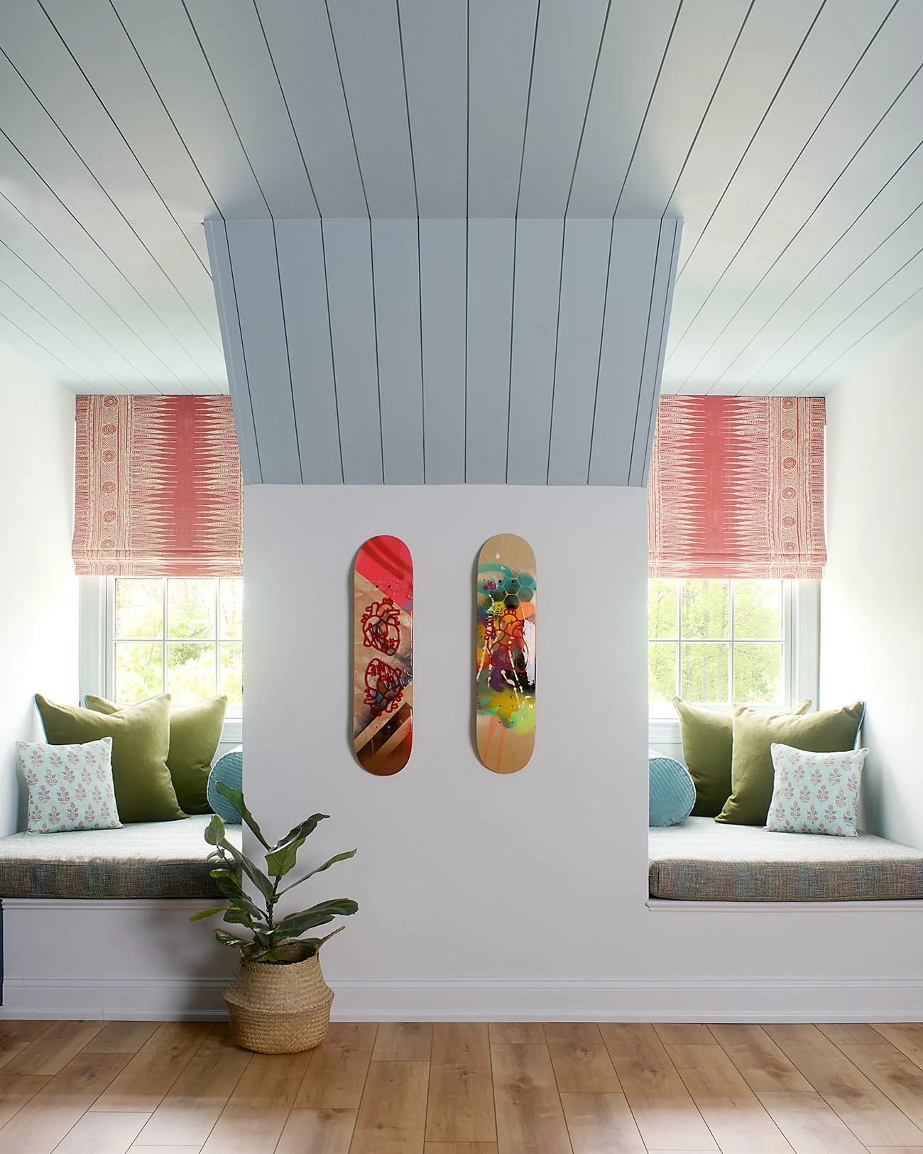 Blue paneled ceiling with seated window nooks