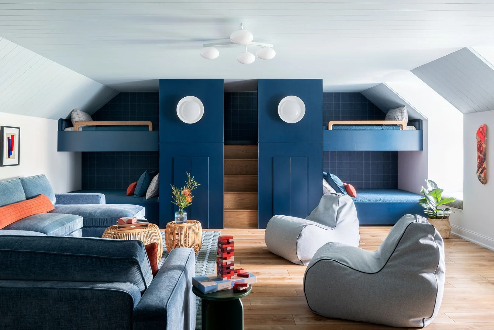 Light and bright attic space with blue and gray furniture