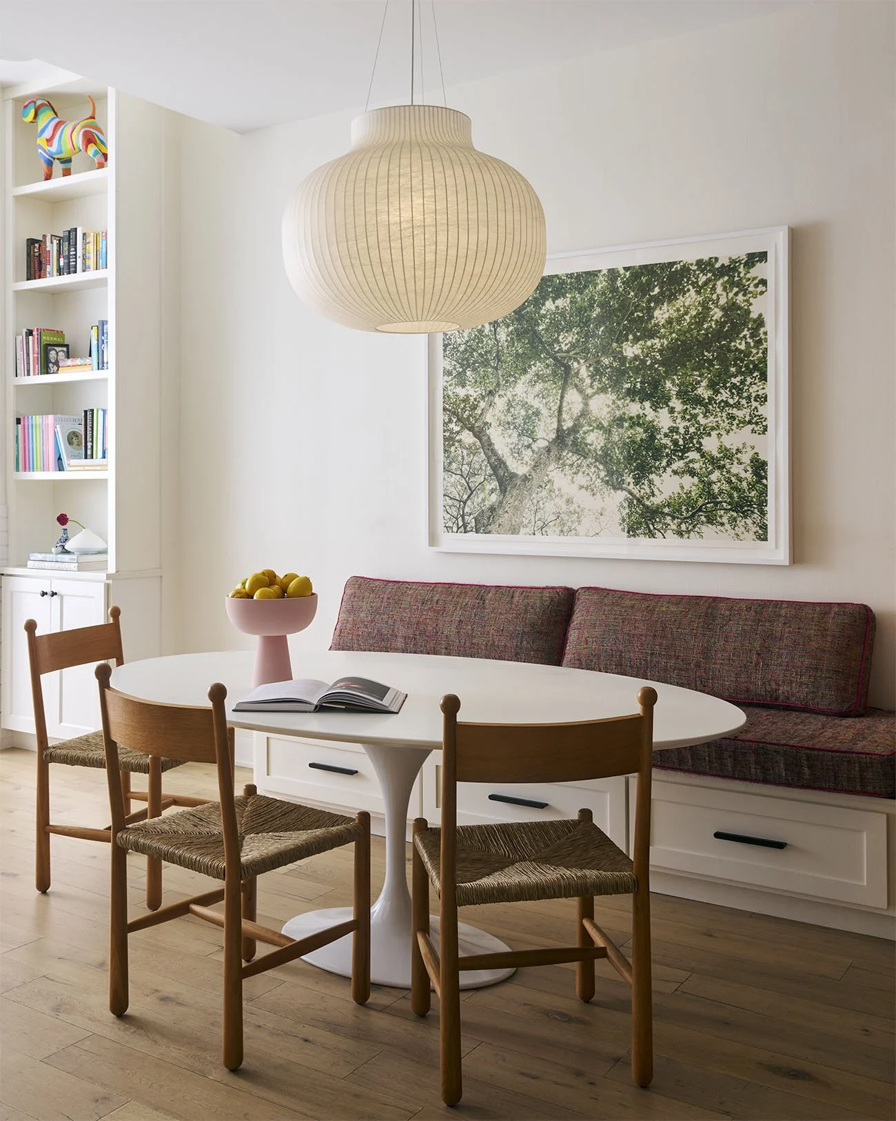 Table and chairs with suspended light in a kitchen