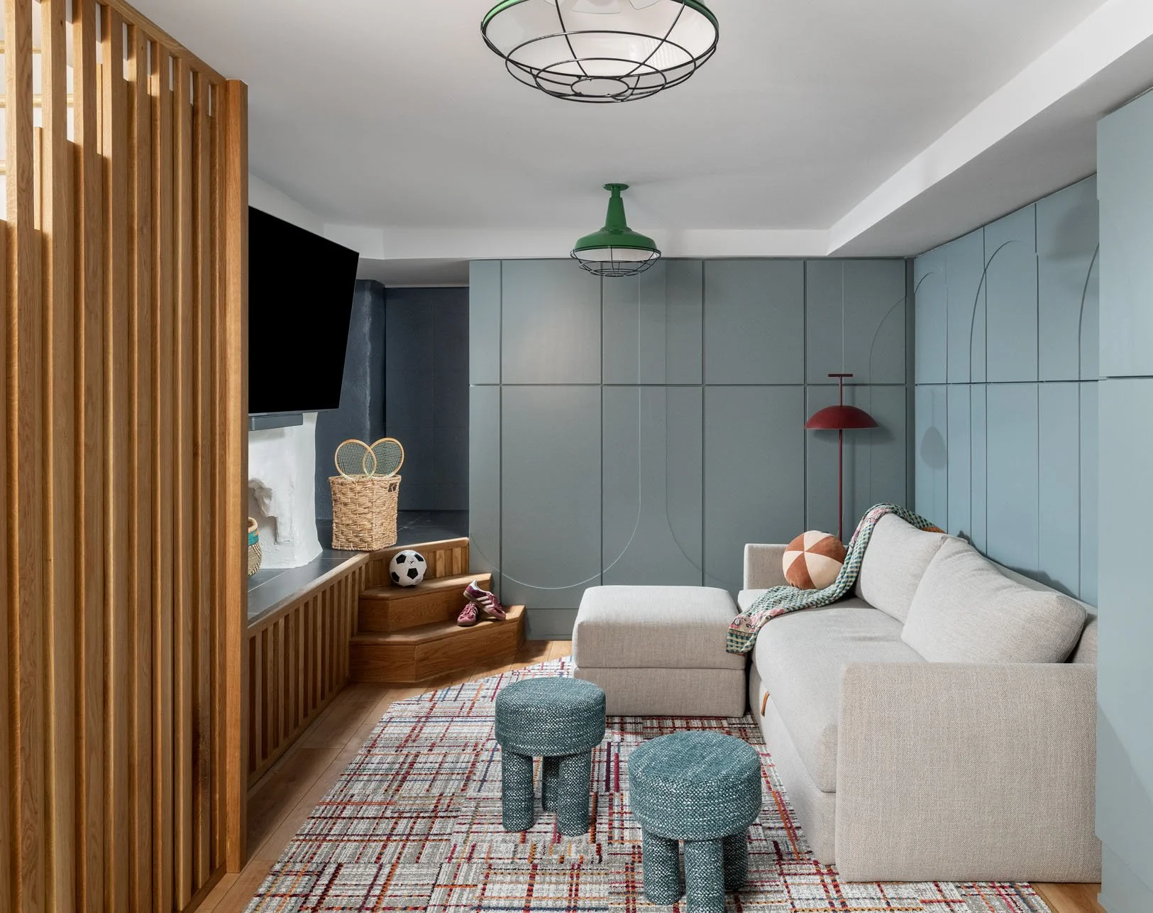 Retro green pedant lamp in basement with modular seating