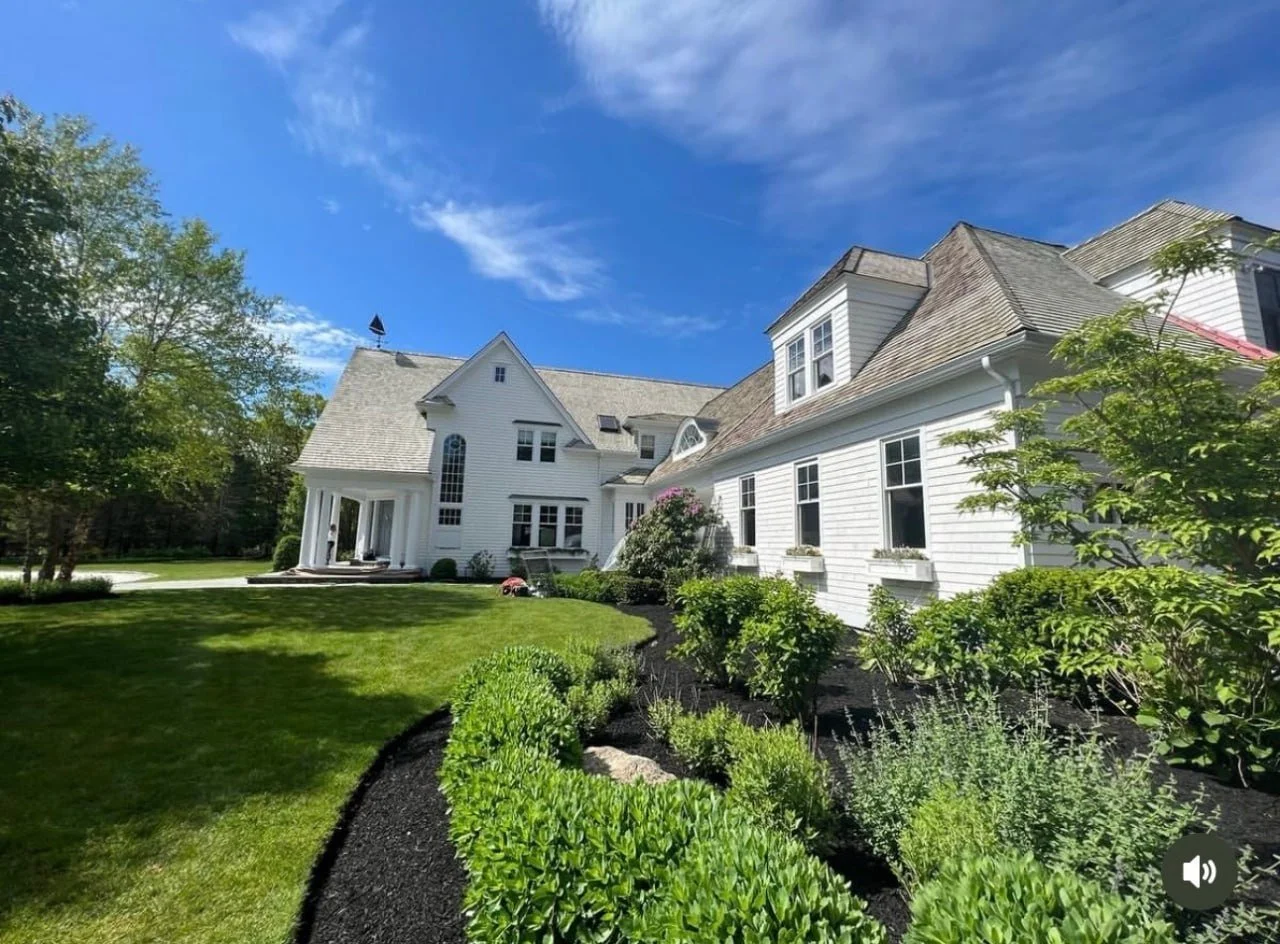 Exterior house being painted — professional painters at work
