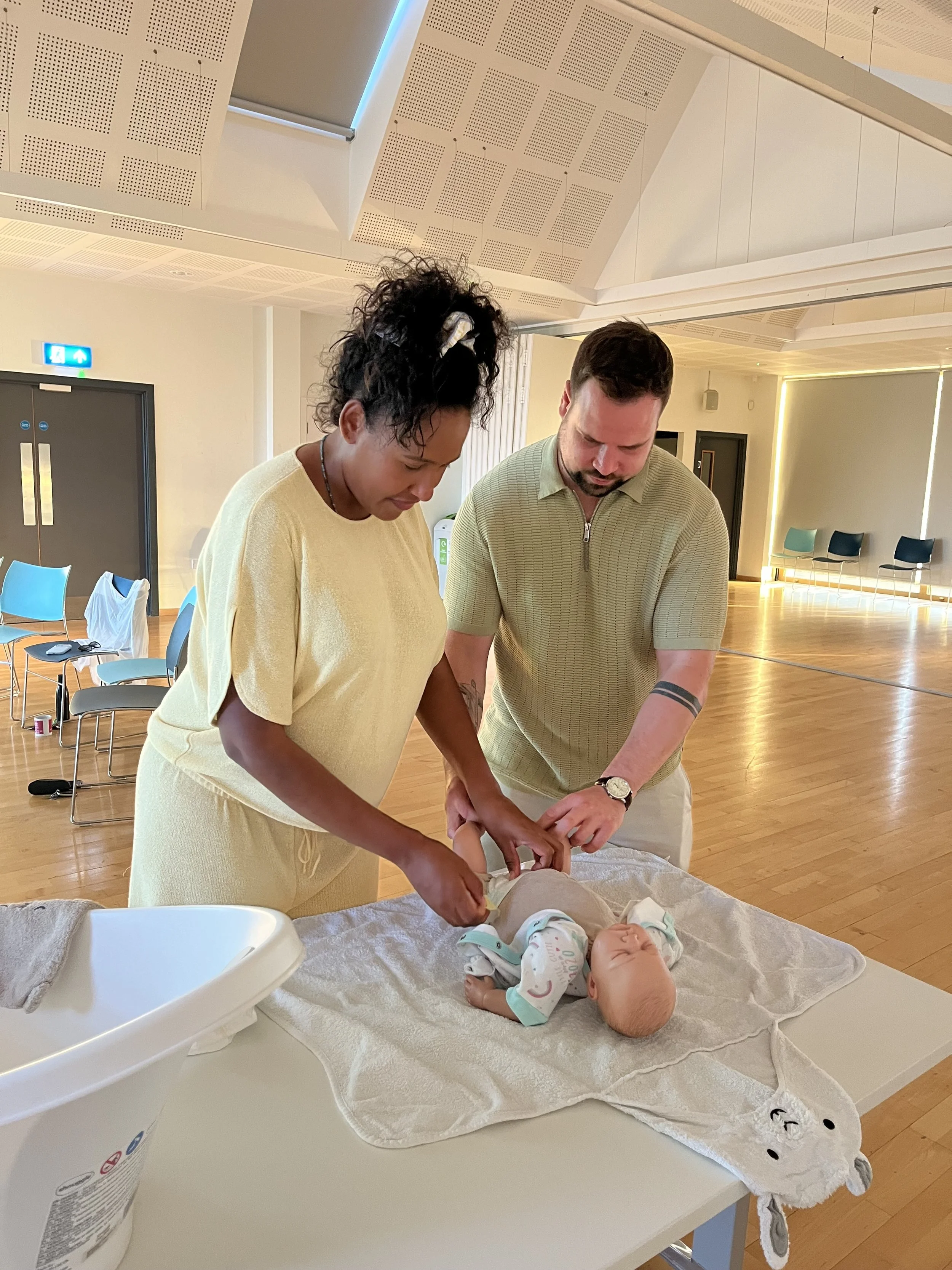 Couples learning about nappies Mindful Bump antenatal class
