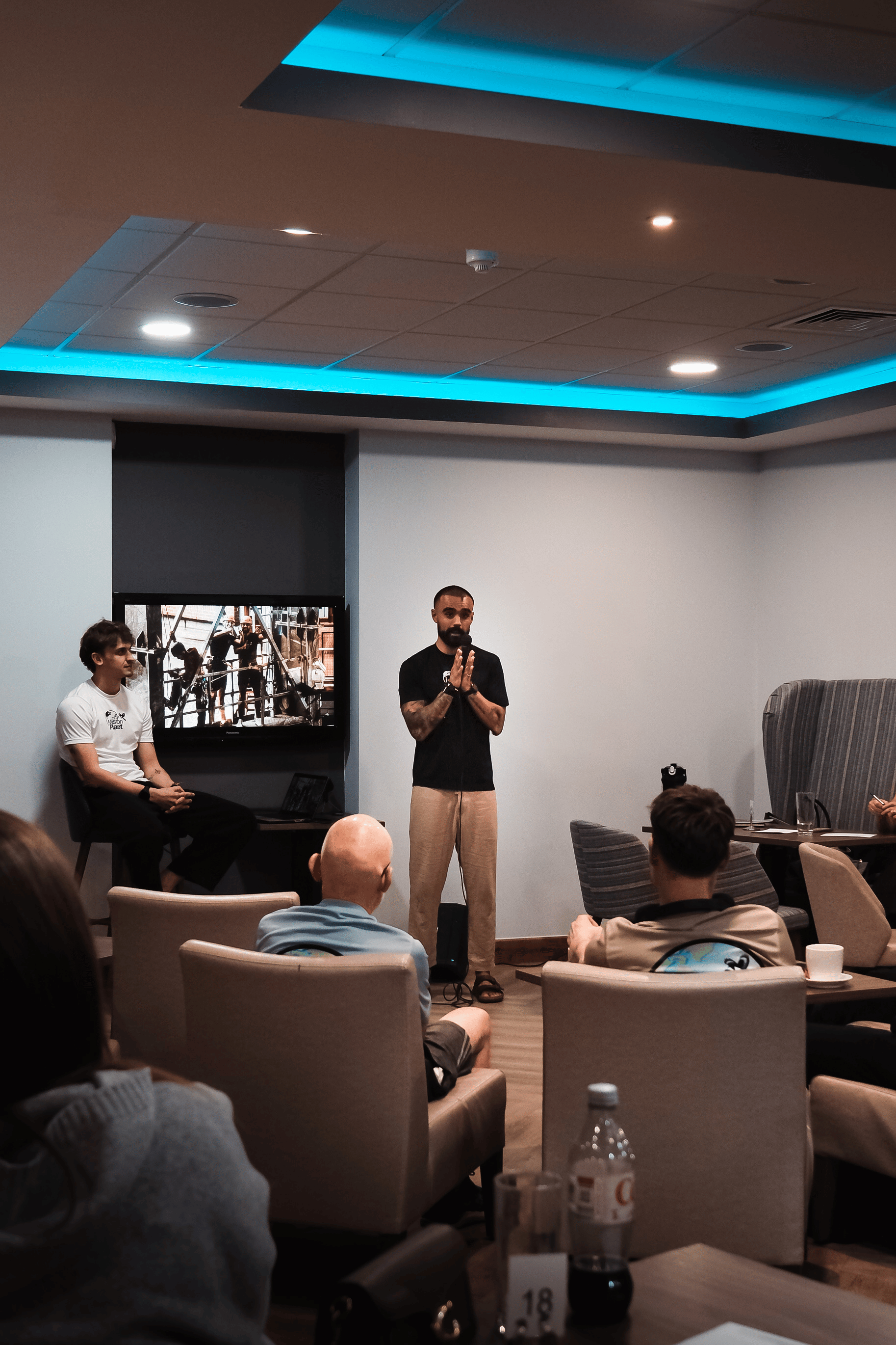 Rohan speaking at Wild Talks after completing his 80-mile run to raise funds for street dogs in India, with The Mission Planet community in attendance