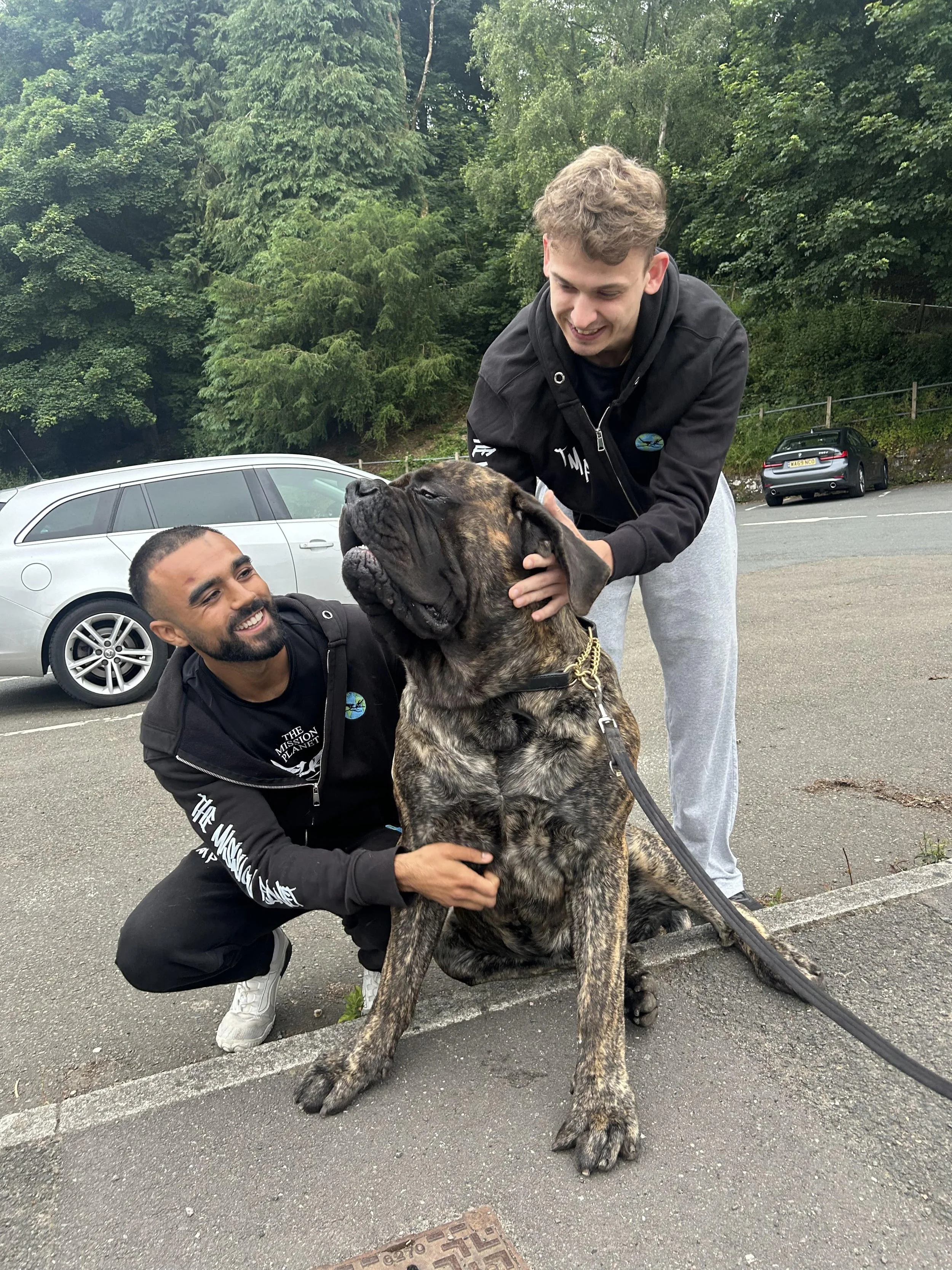 Rohan and Tom spending time with a rescued street dog during a Mission Planet animal welfare mission