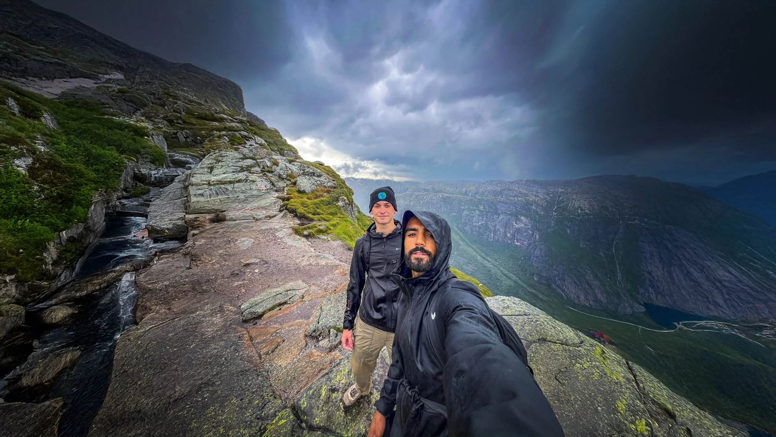 Rohan Mahan and Thomas Dunn, founders of The Mission Planet CIC, hiking together during a community challenge in a mountainous landscape.