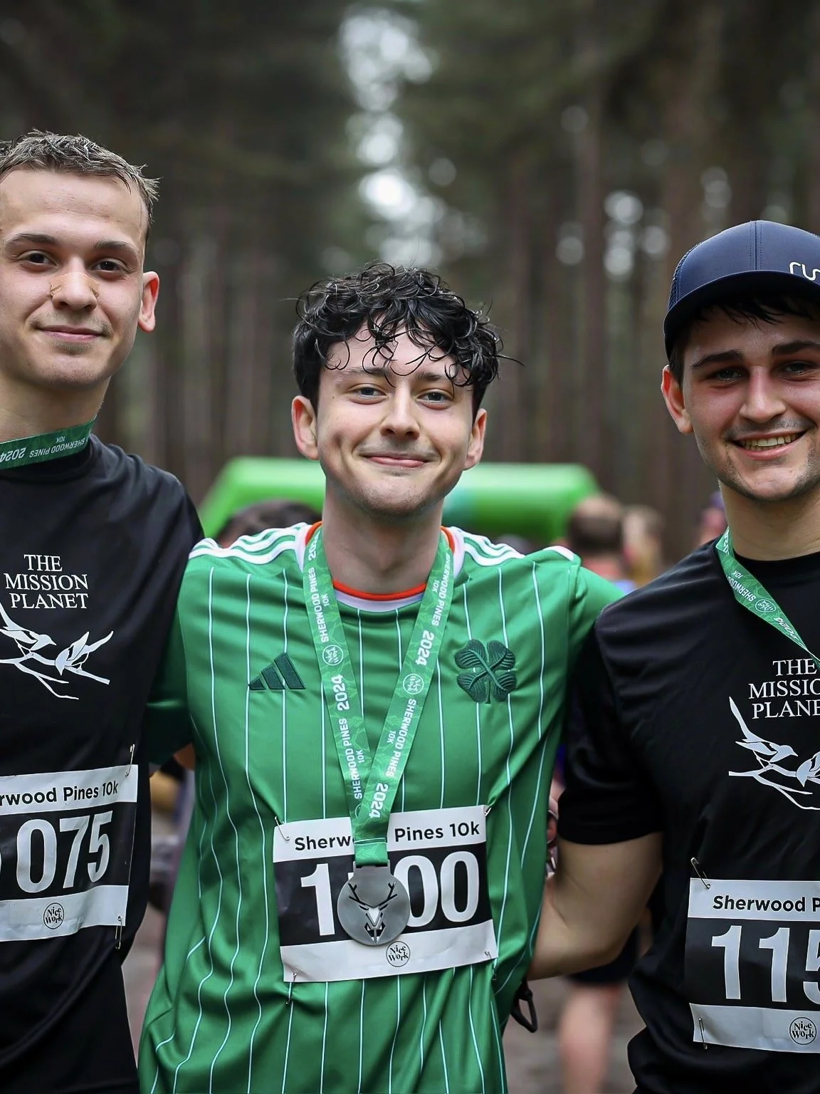 Tom from The Mission Planet CIC with fellow runners after completing a fundraising challenge supporting community impact projects.