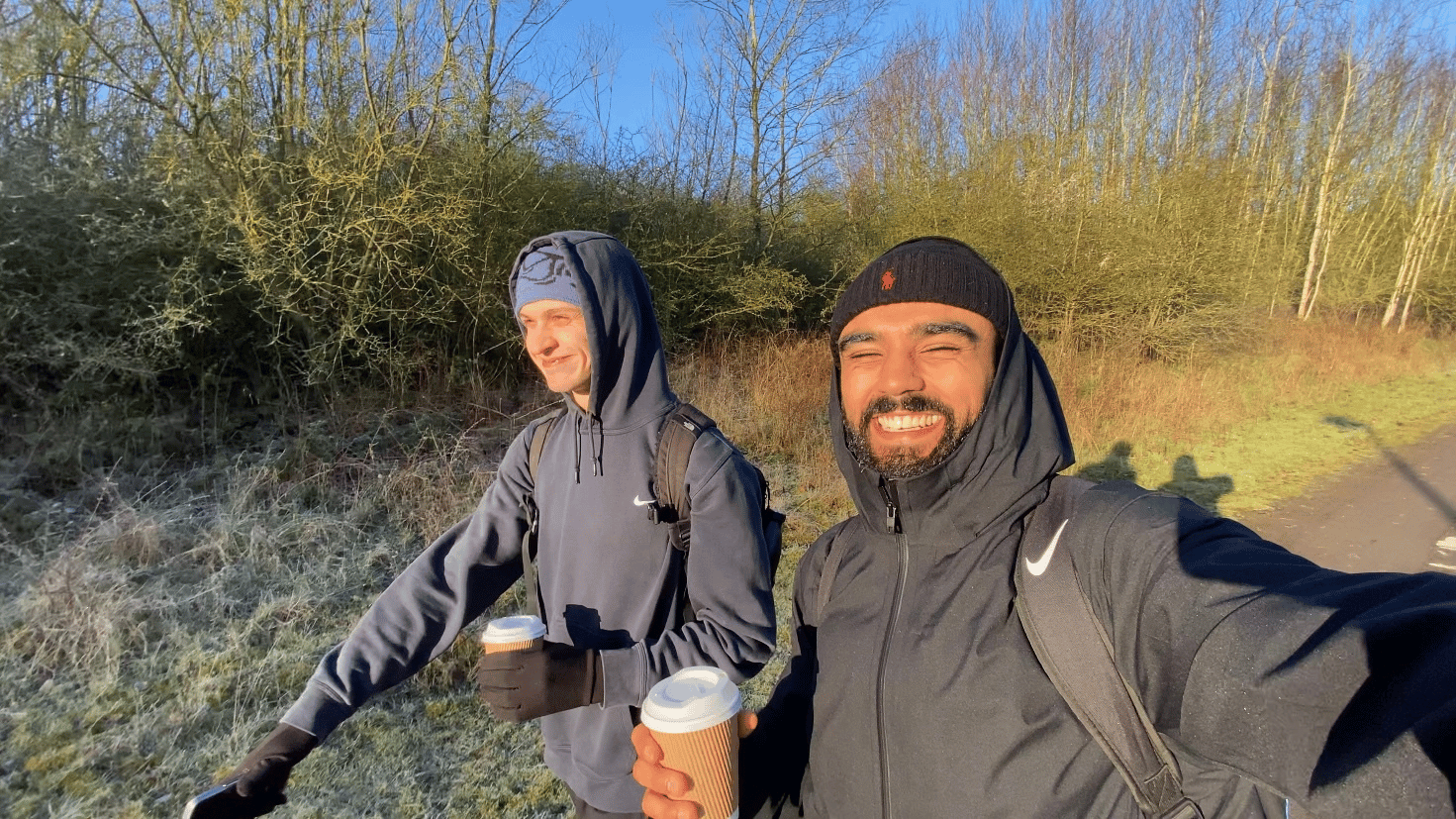 Rohan and Tom walking outdoors during a Mission Planet challenge, reflecting the active, community-led nature of the mission