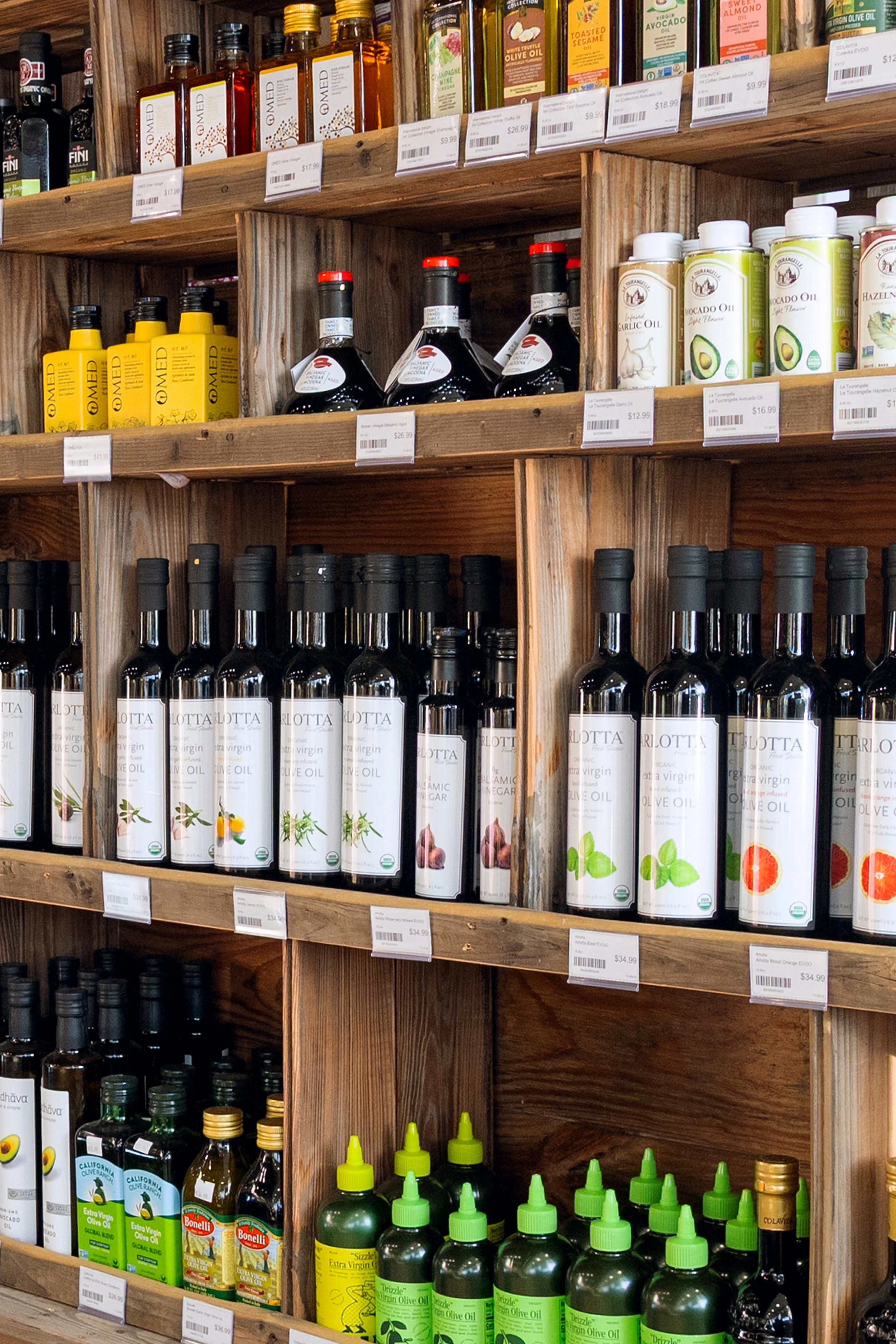 Shelves of pantry items including olive oil