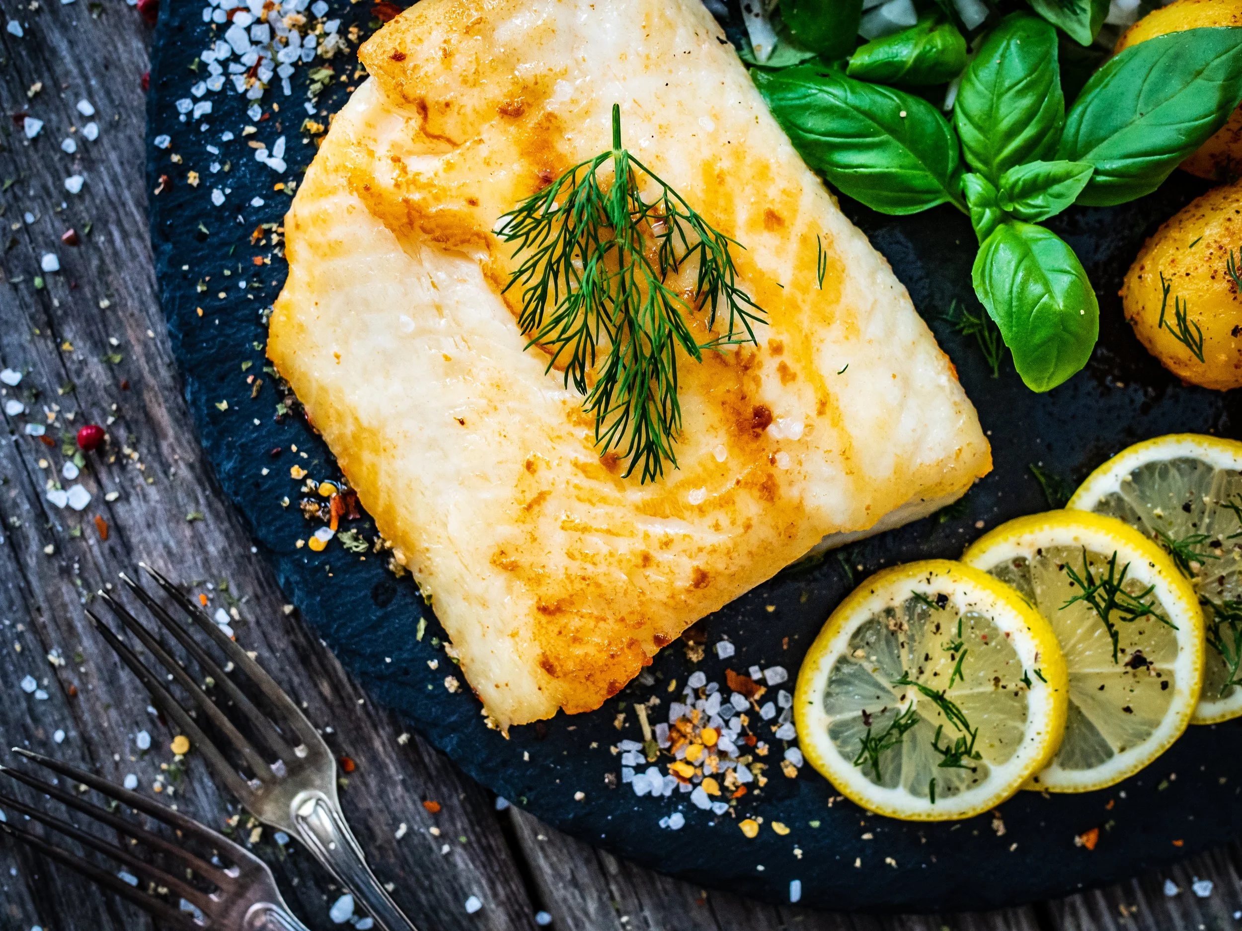 Pan seared halibut fillet with dill and lemon