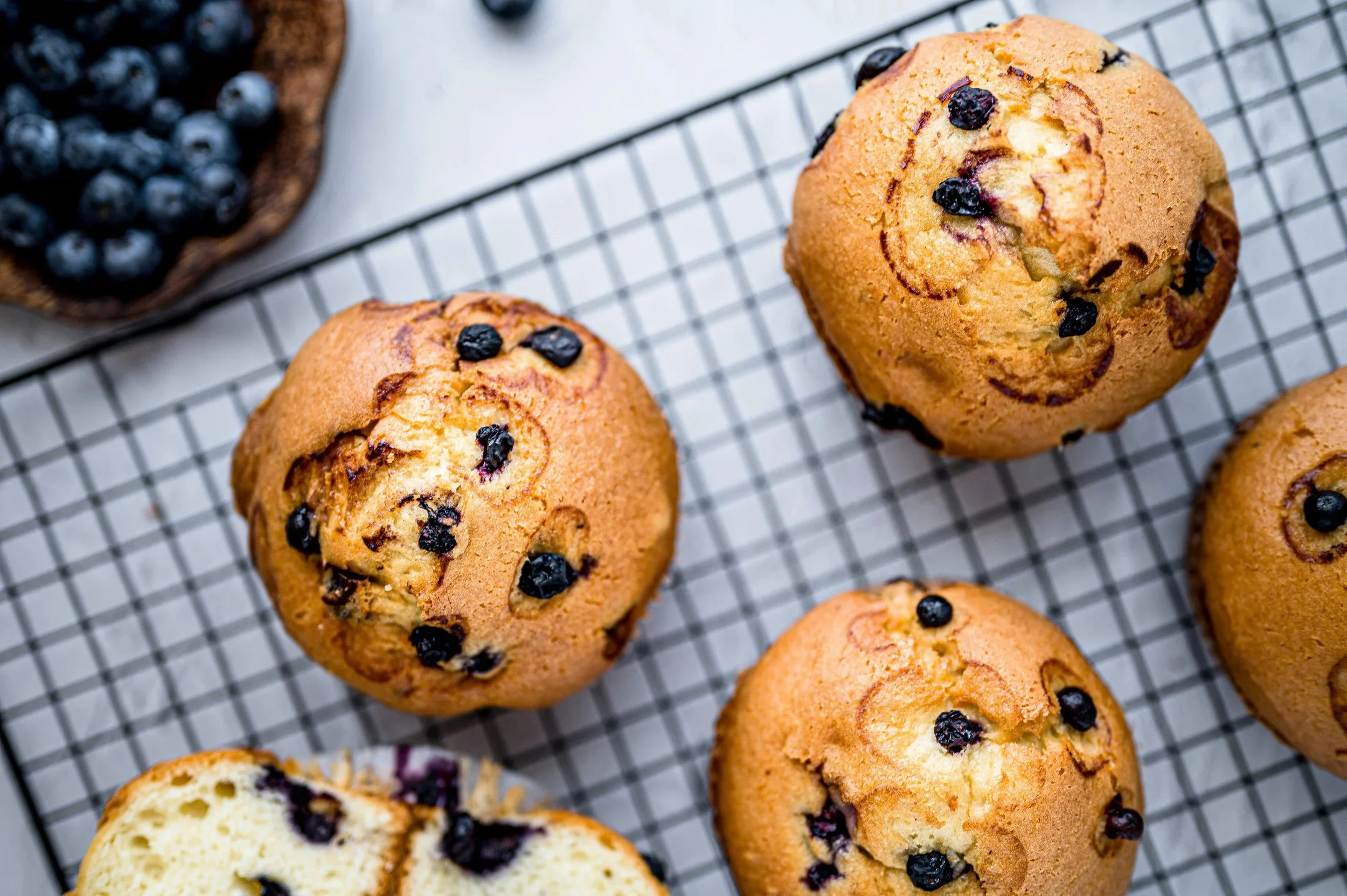 Fresh blueberry muffins on a rack