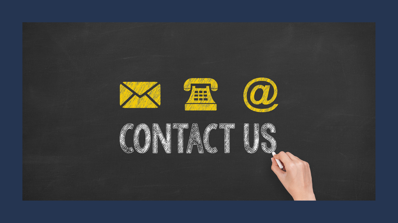 Hand writing 'CONTACT US' on a chalkboard with icons of an envelope, telephone, and at symbol above.