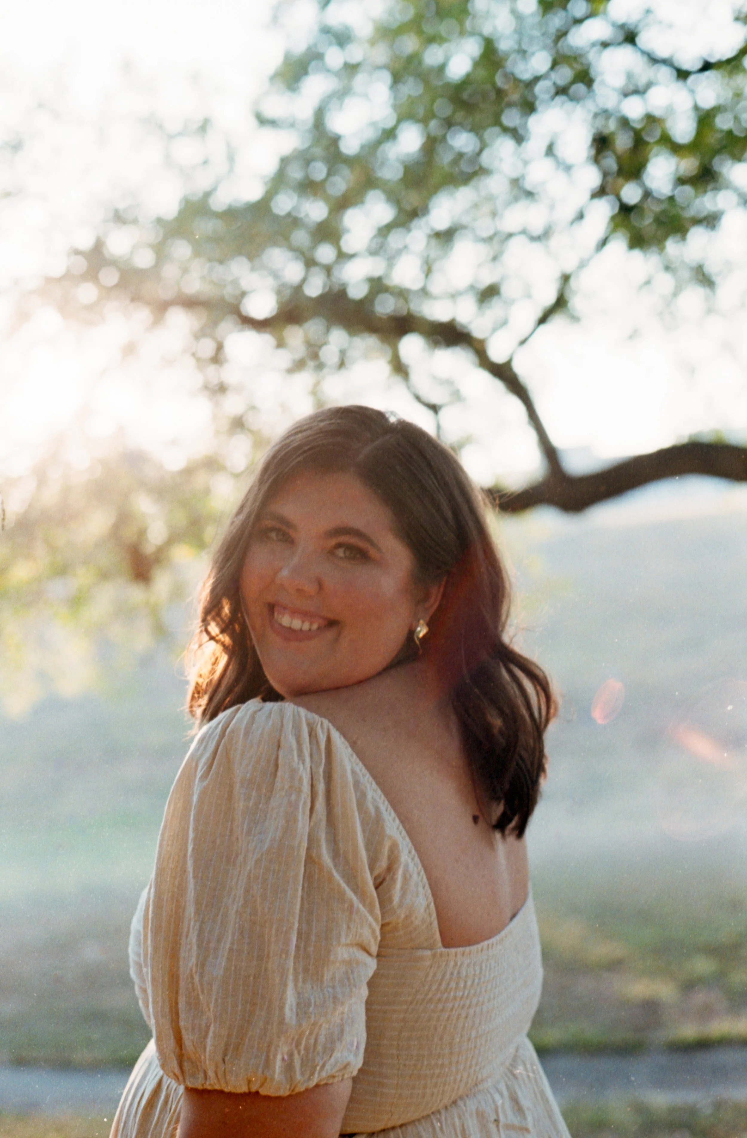 Cheyenne Allgood, luxury wedding content creator based in Texas, photographed in soft natural light outdoors