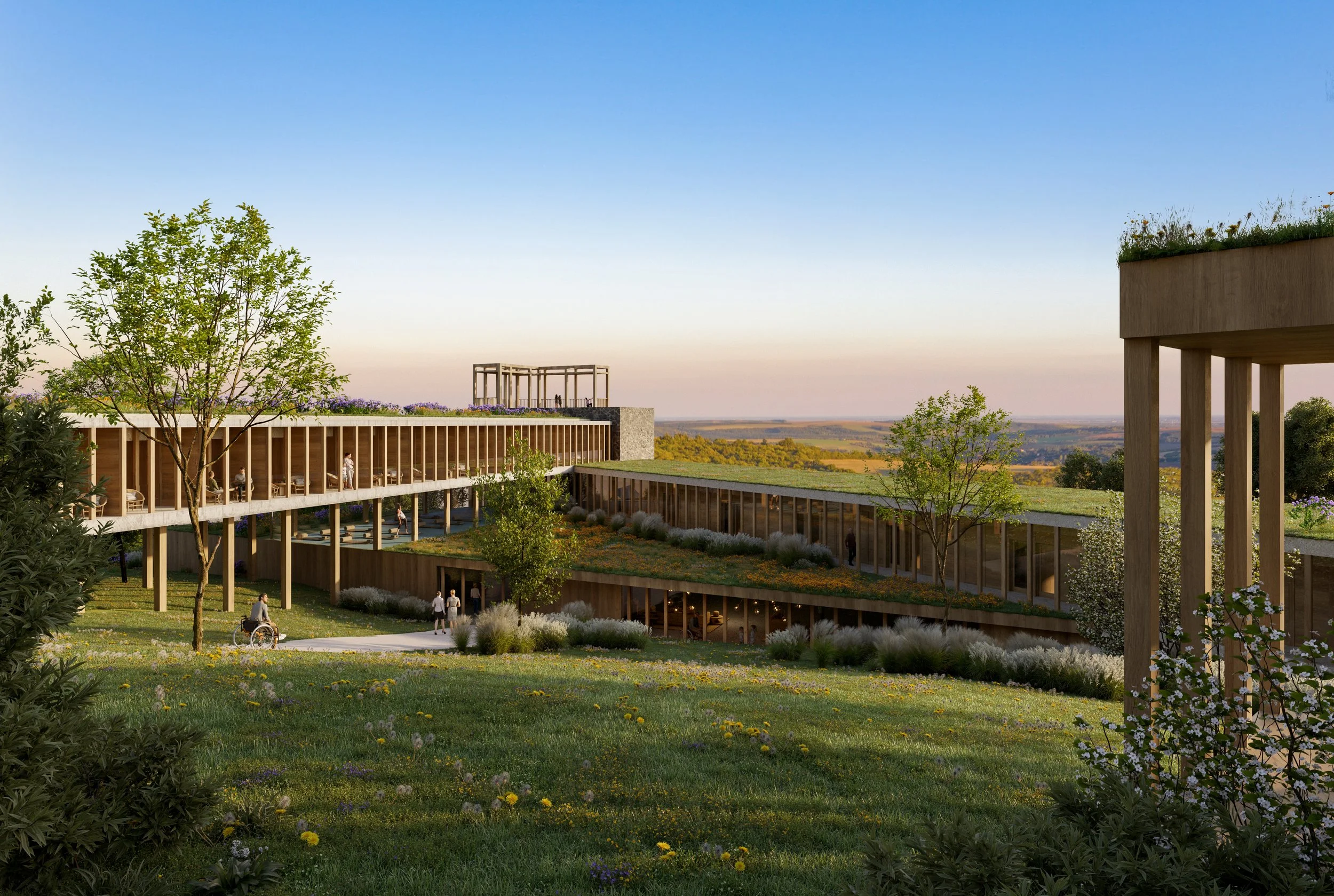 Architectural rendering of a modern green building with rooftop gardens and large windows, surrounded by trees and grass, overlooking a scenic landscape at sunset.