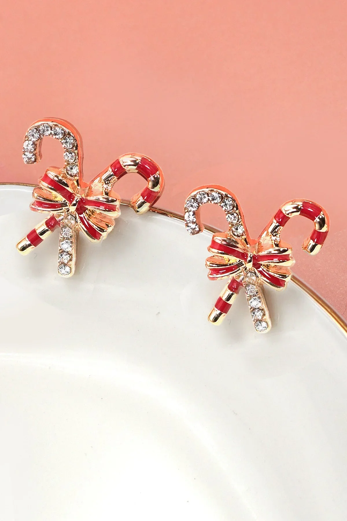 candy-cane-rhinestone-bow-earrings-closeup-rose-and-kate.webp