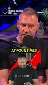A man speaking into a microphone during a digital social hour, with a large red upward arrow and text that reads 'AT FOUR TIMES' and 'DATA + feelings' on his shirt.