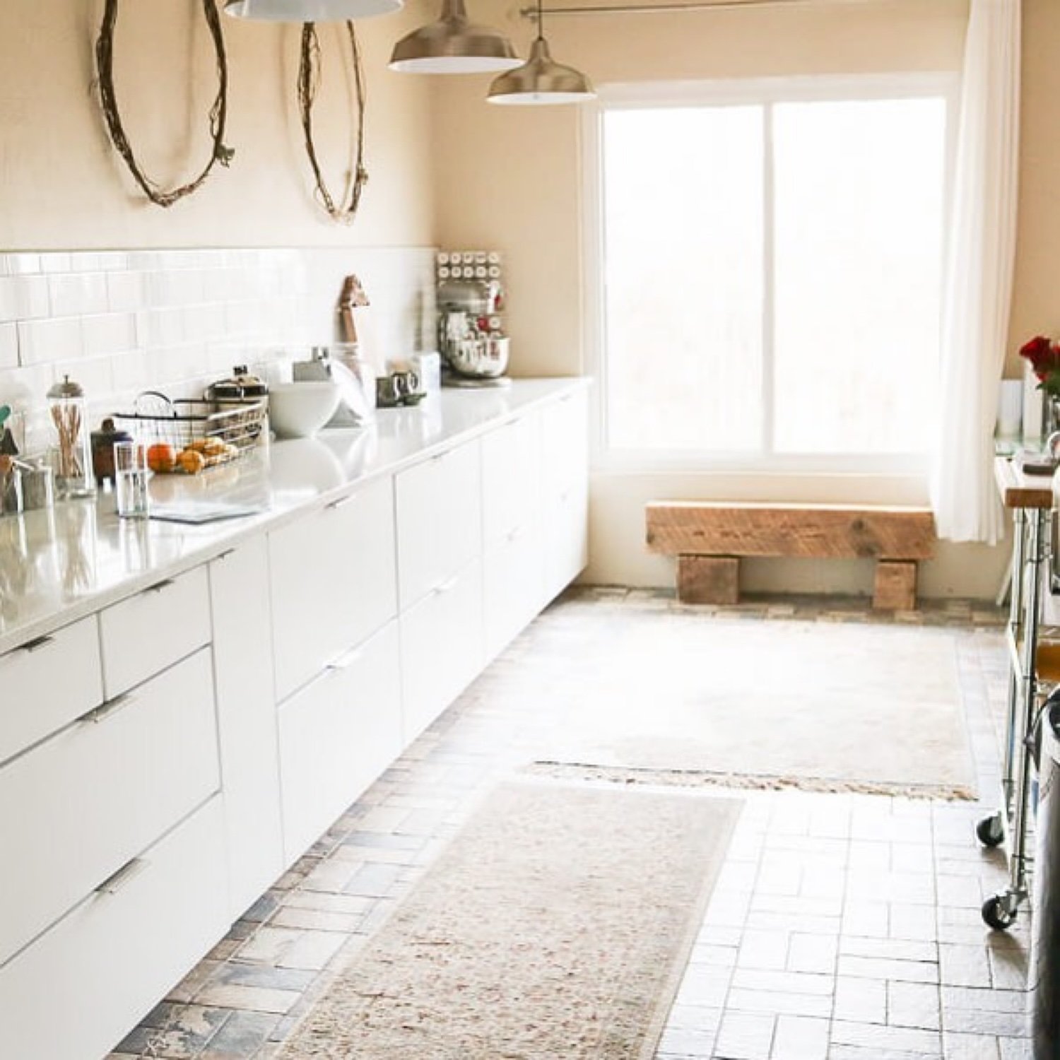 East window with wood bench