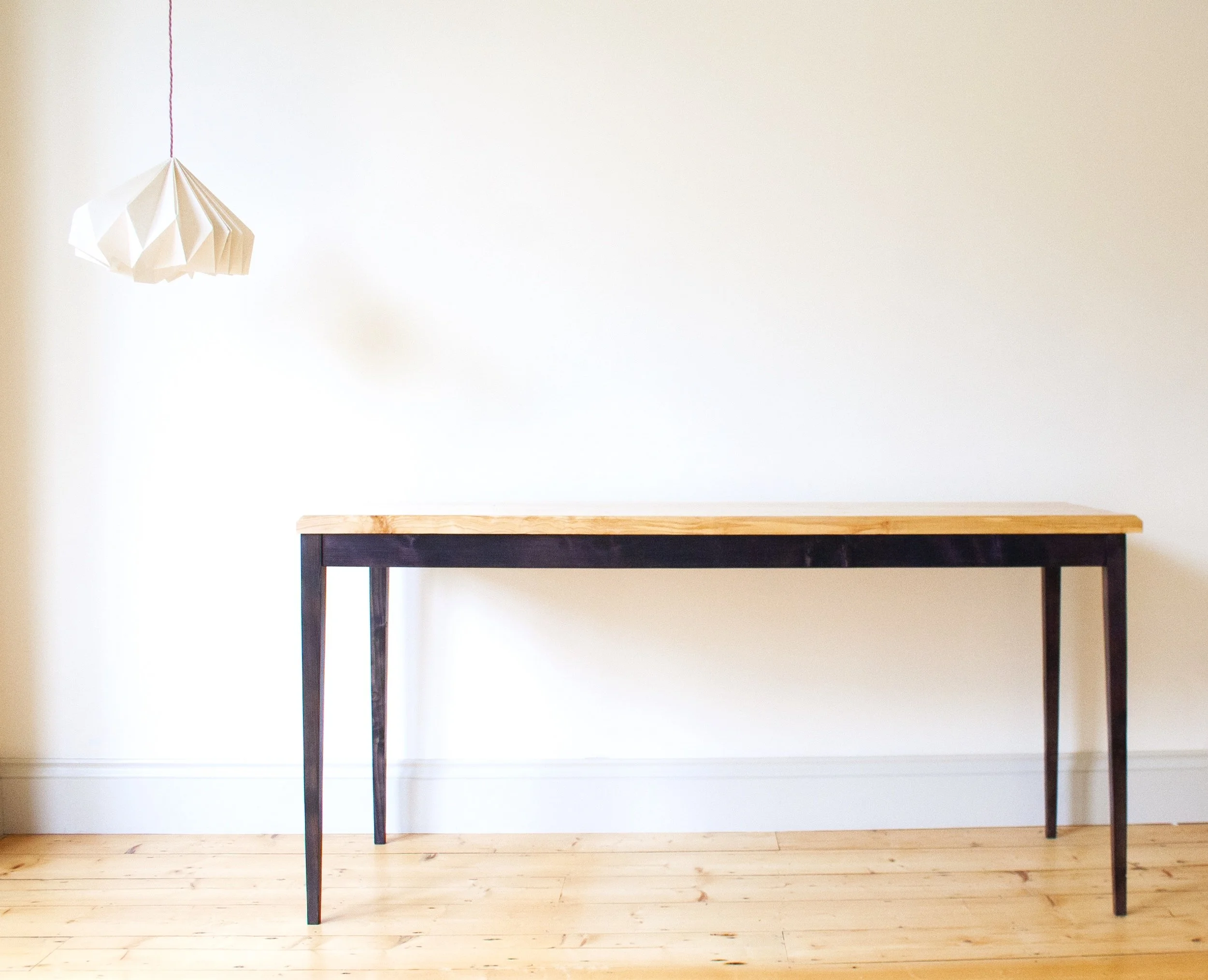 The Calder Table made with a solid spalted silver birch top and black stained elegant tapered legs