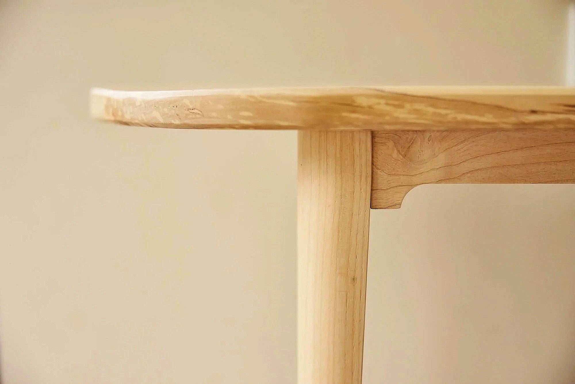 Close-up of a bespoke wooden bench made to order in a workshop near Bristol