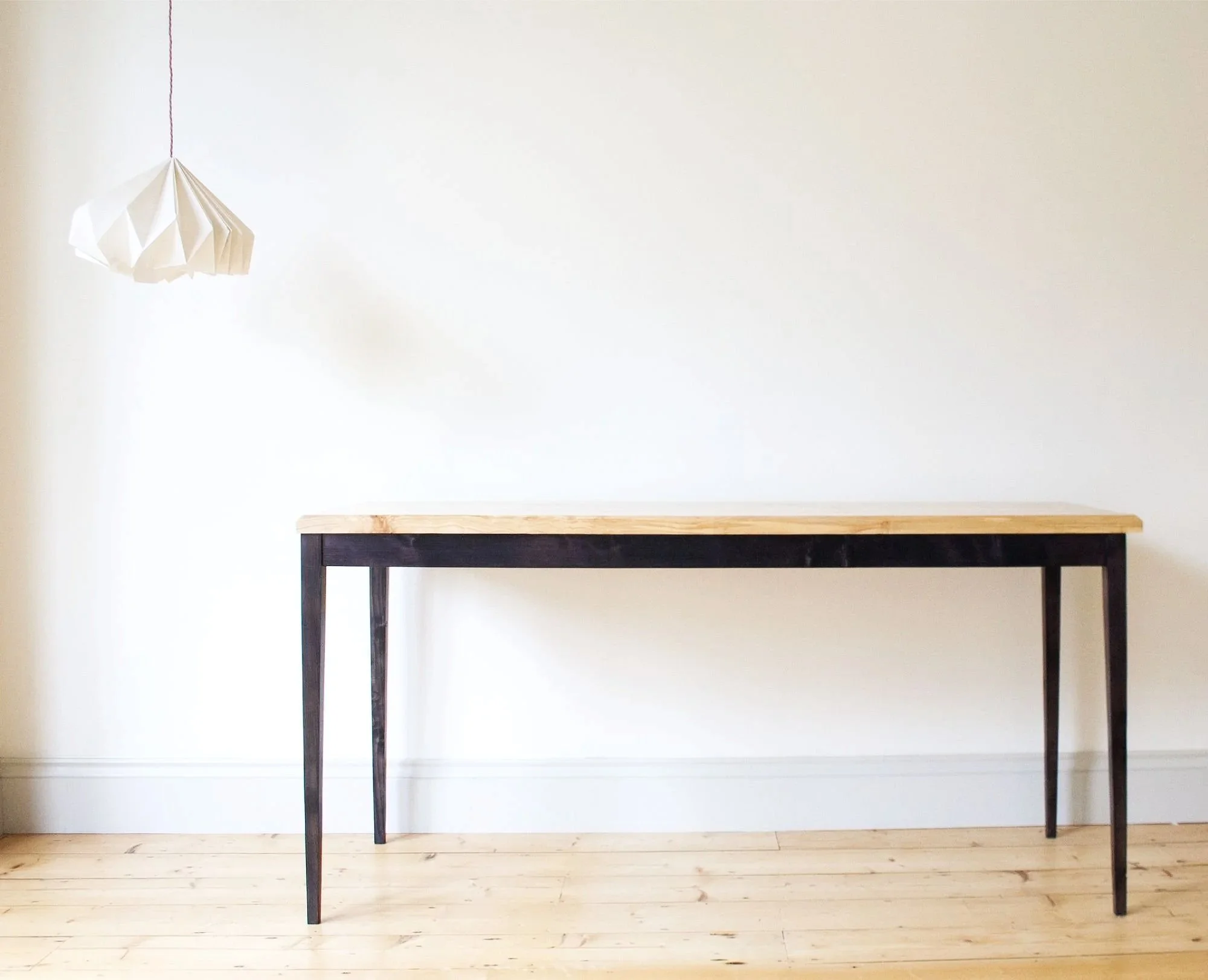 The Calder Table a simple spalted timber top with elegant black stained tapered legs 