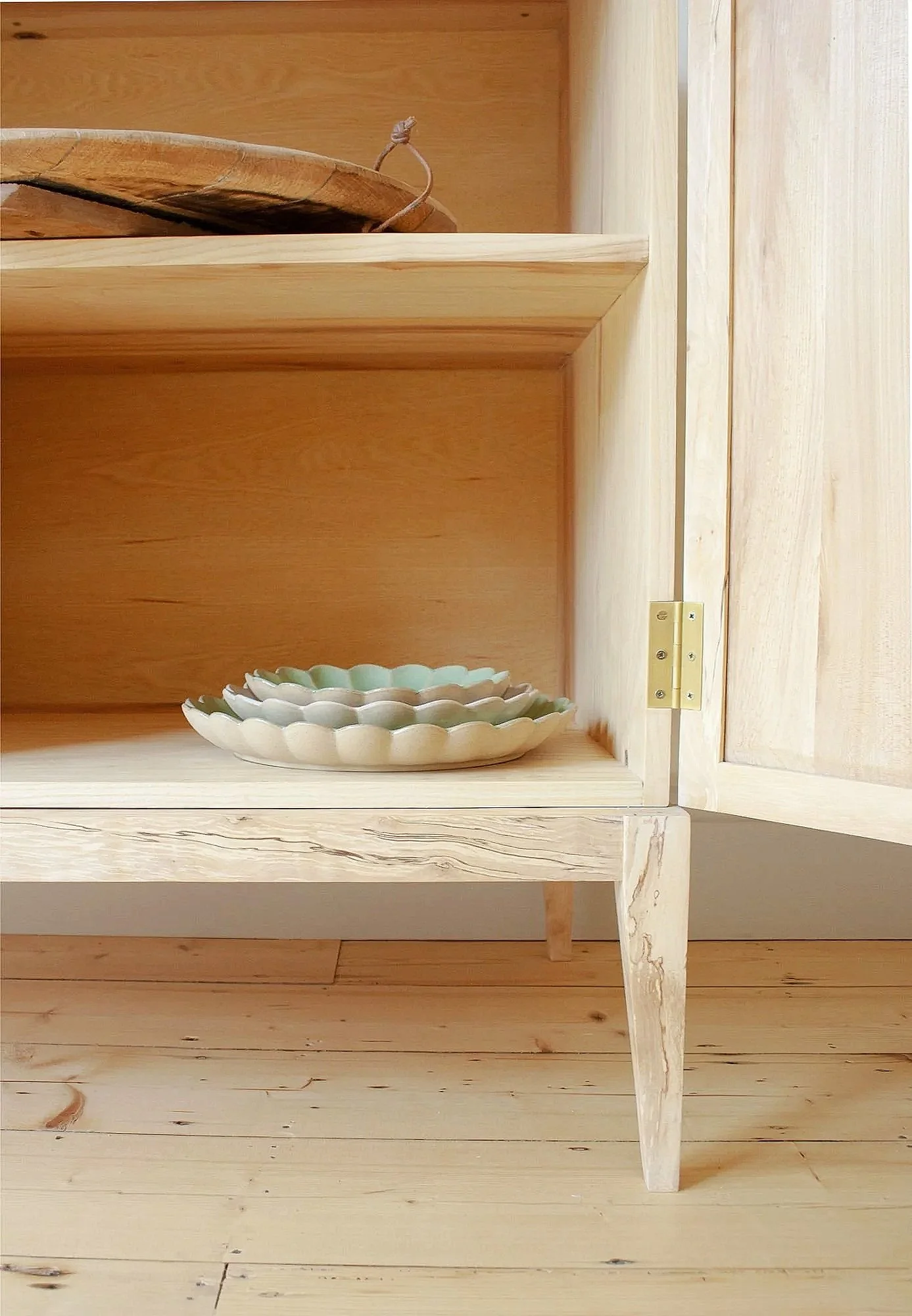 An interior shot of The Farrow Cabinet a solid timber cabinet made by Trew and Bold in their Bath workshop