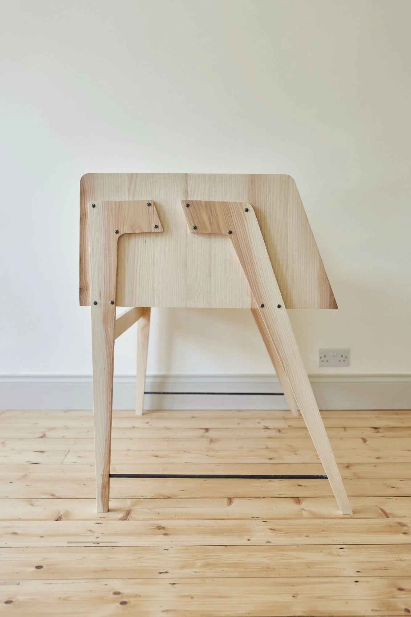 Side view of an ash bespoke music production desk mid-century inspired