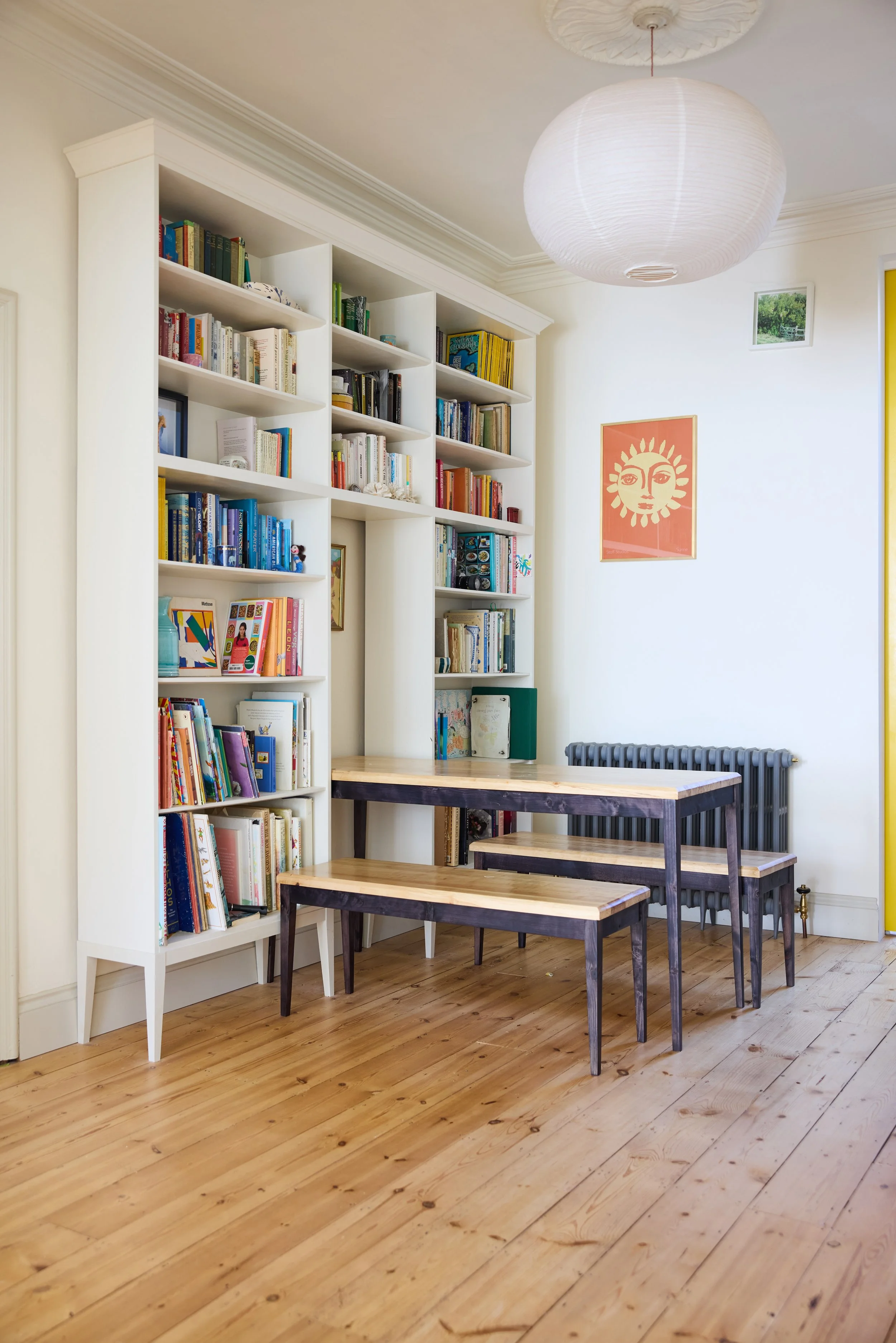 Table and benches designed bespoke for a client to fit within a custom alcove in a bookshelf