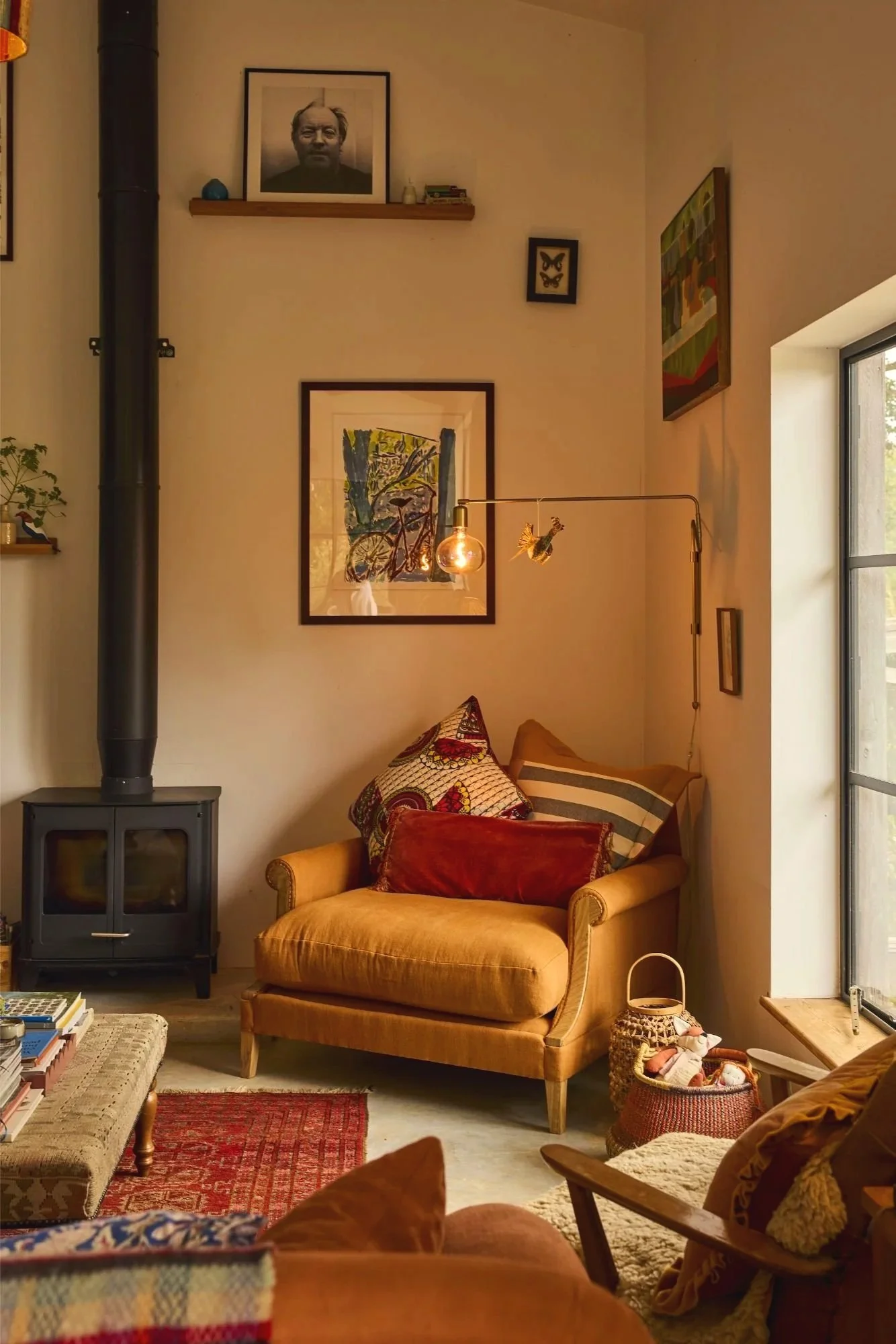 An orange armchair with a solid oak frame and traditional upholstery in a cozy living room