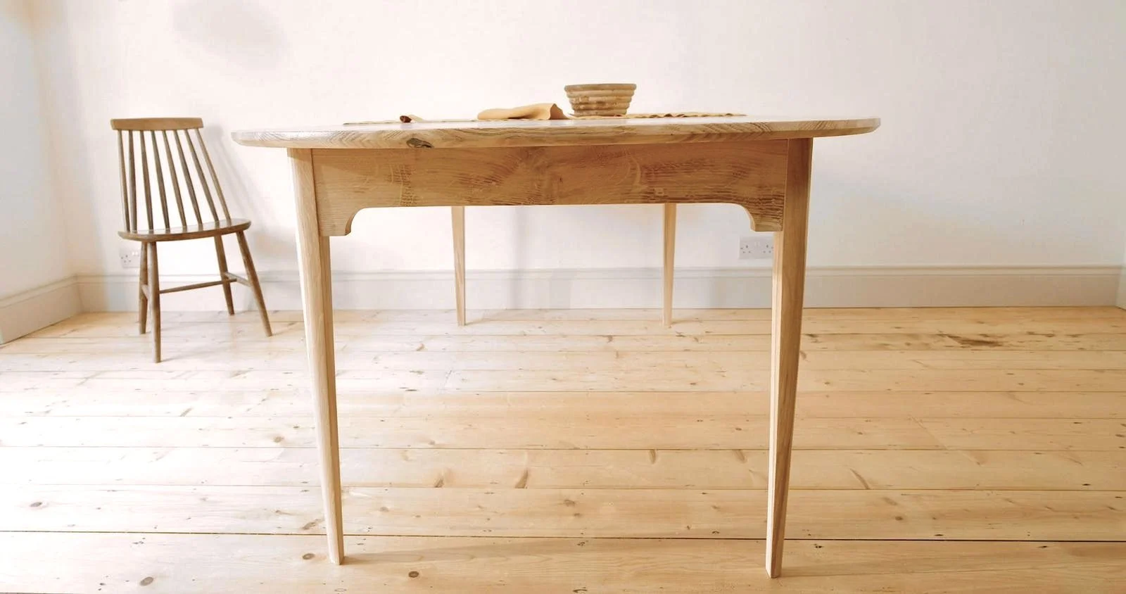 Detail of the Mid-Century inspired details on the bespoke Orwin Extending table made from solid british oak