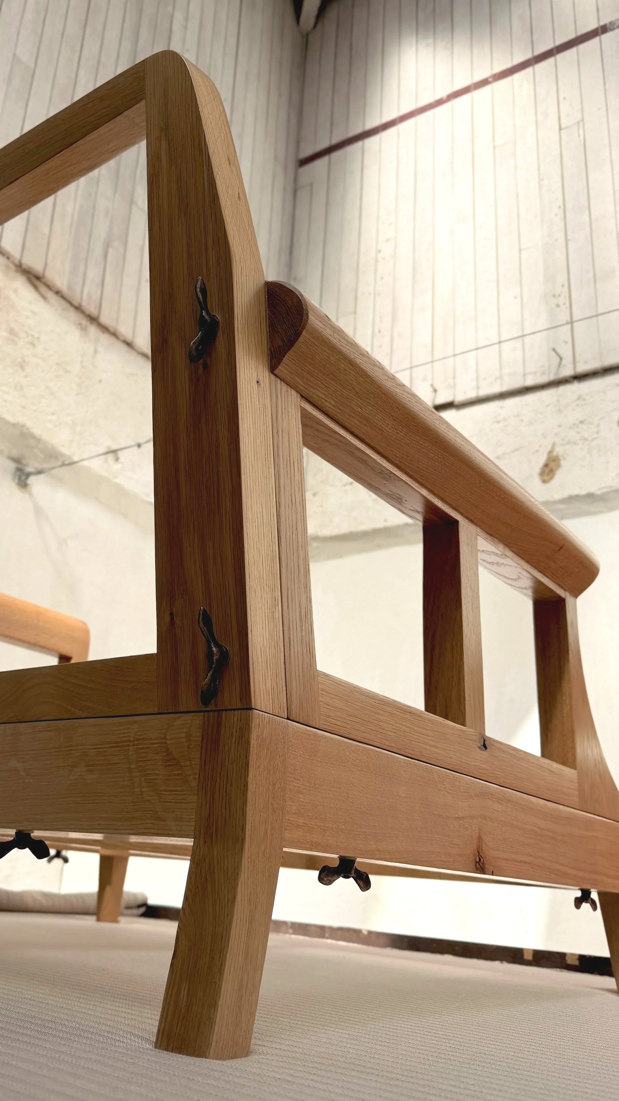 Hand finished solid oak chair frame the bones of The Aldan armchair