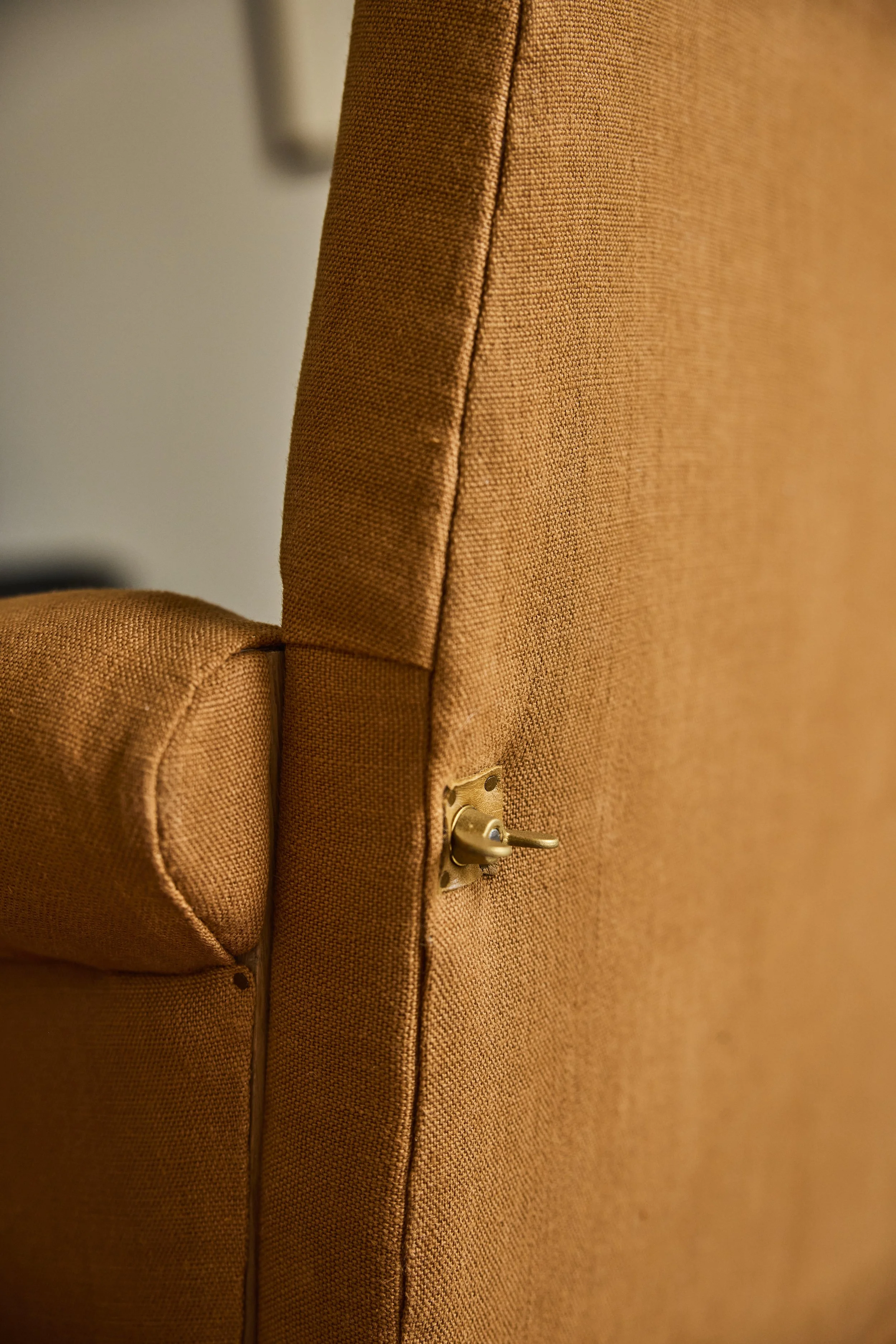 Detail of the solid brass bolt heads on The Aldan Loveseat
