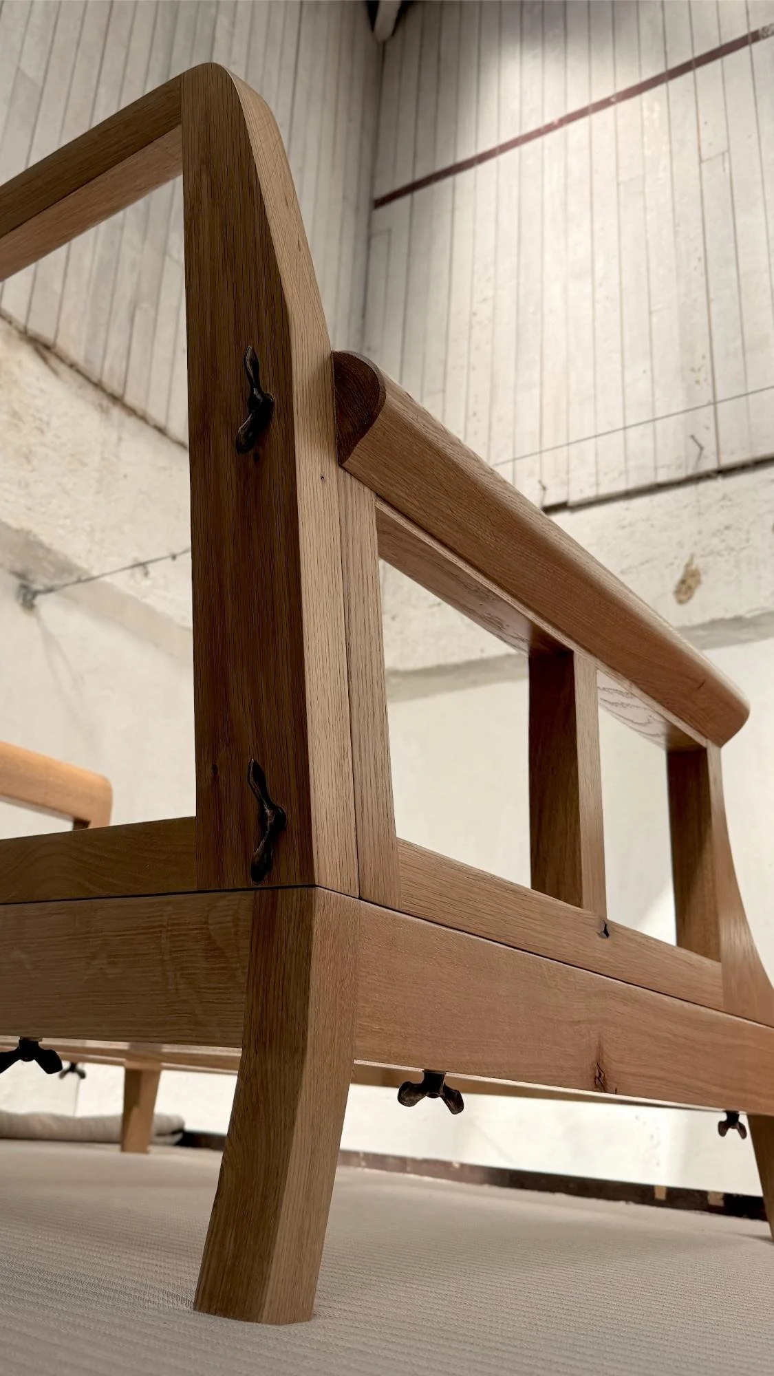 Hand finished solid oak chair frame the bones of The Aldan armchair