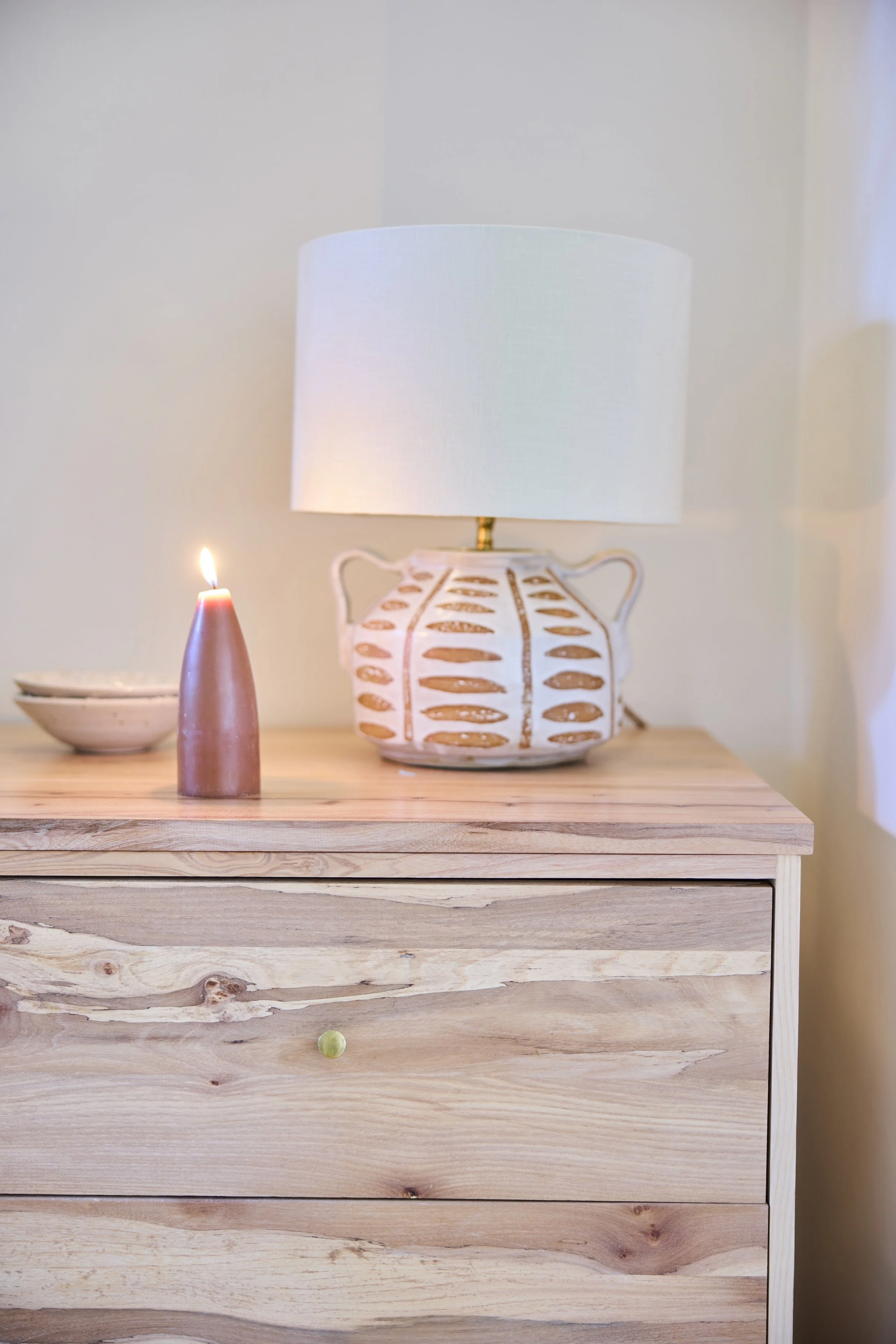 Design detail of the Thorne Chest of Drawers made by hand in a workshop near bristol with an ash carcass and spalted elm drawer fronts