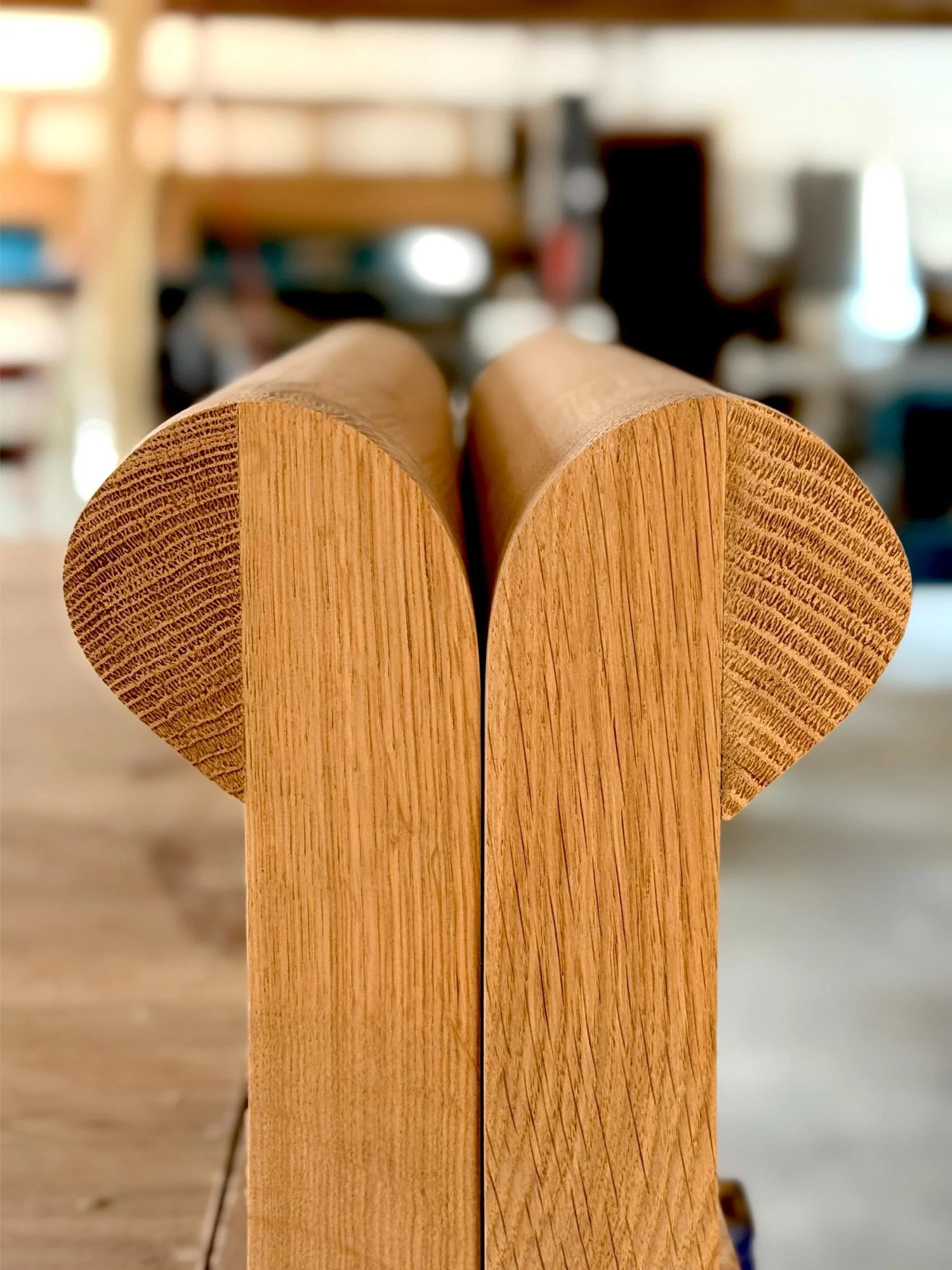 Close up of solid wood chair arms in a furniture workshop near Bath