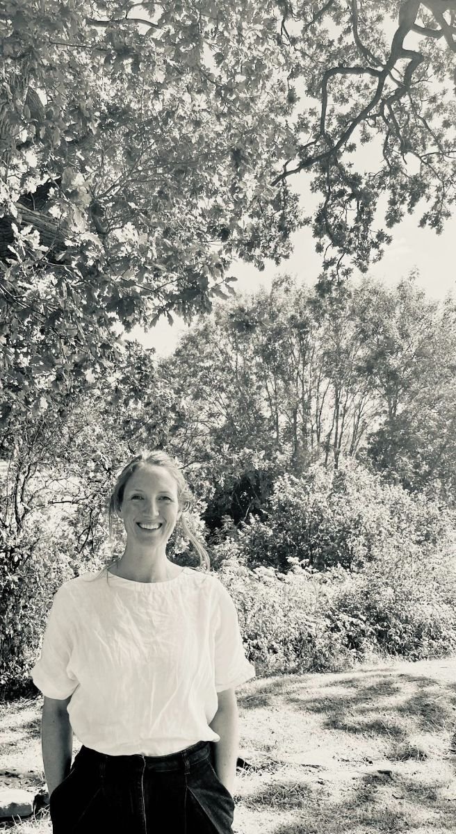 Trew & Bold Founder Emily, smiling in a woodland setting