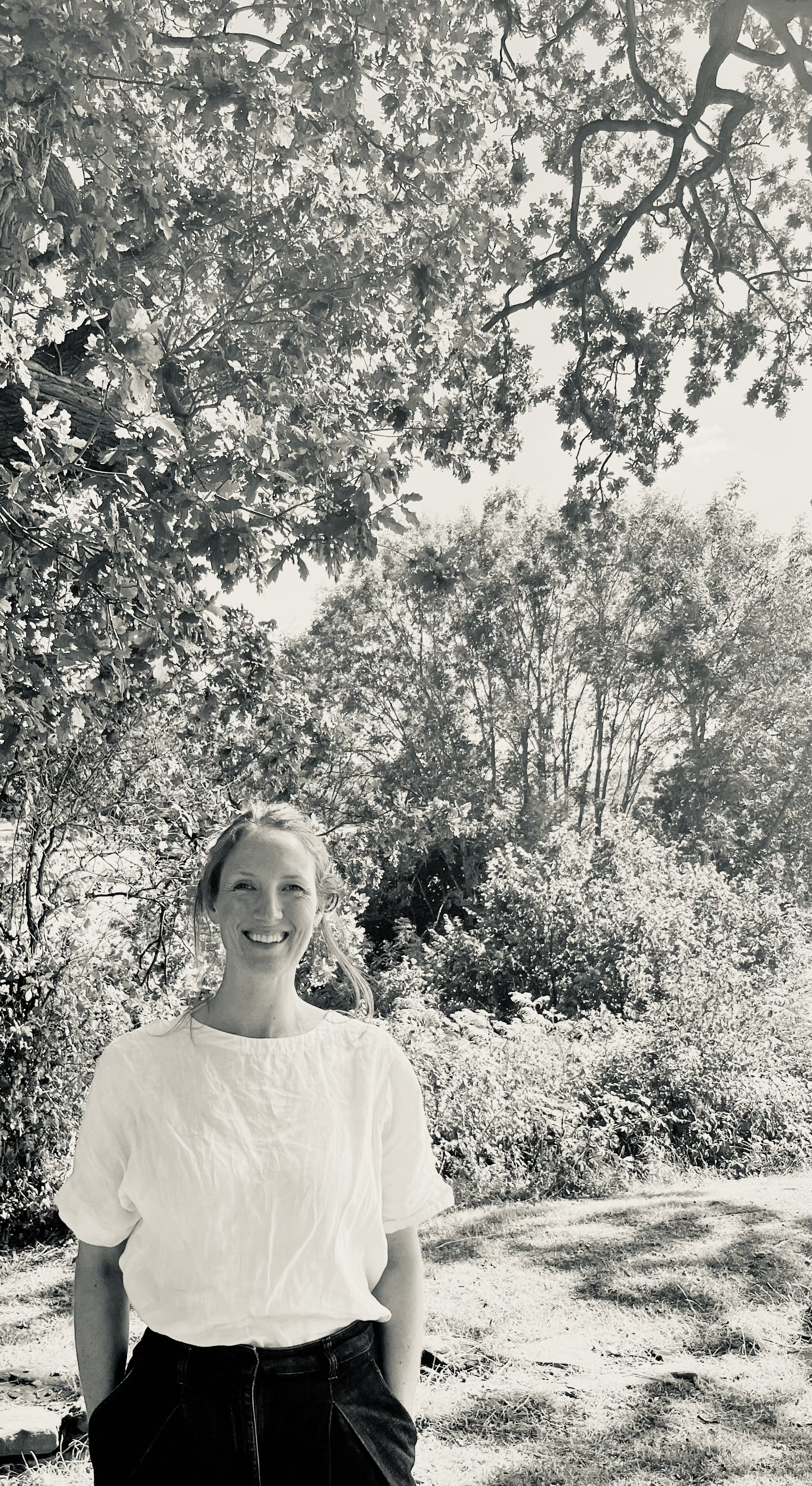 Trew & Bold Founder Emily, smiling in a woodland setting