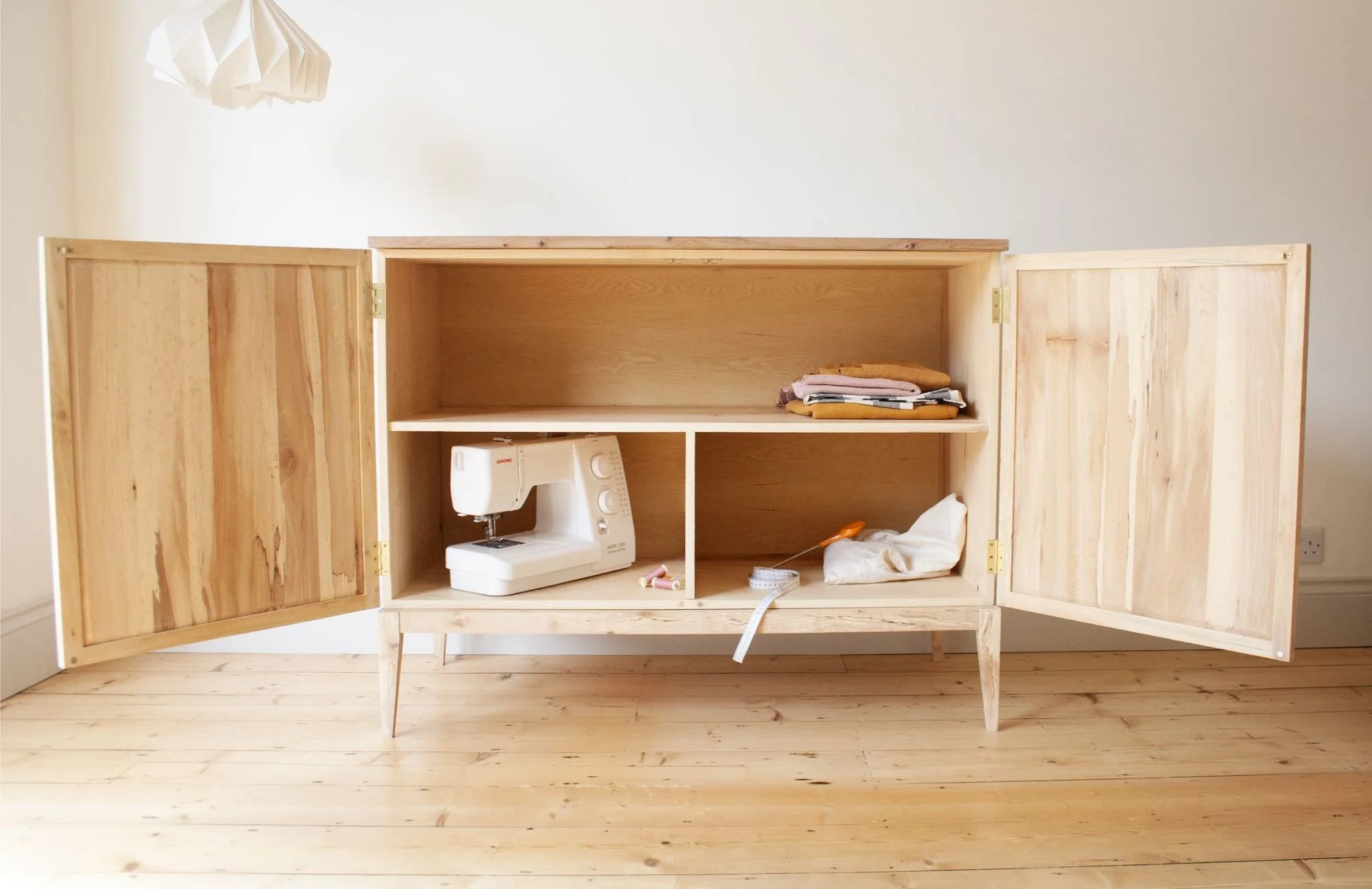 The interior of the Farrow cabinet, a solid wood large sideboard crafted from british timbers; ash, birch and elm.