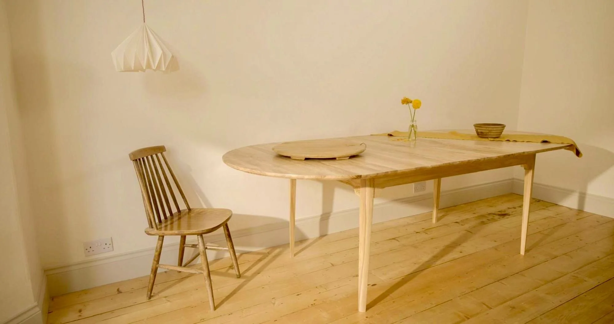 The Orwin Extending made from solid oak, mid-century inspired design. seats 10 comfortable and 12 cozily