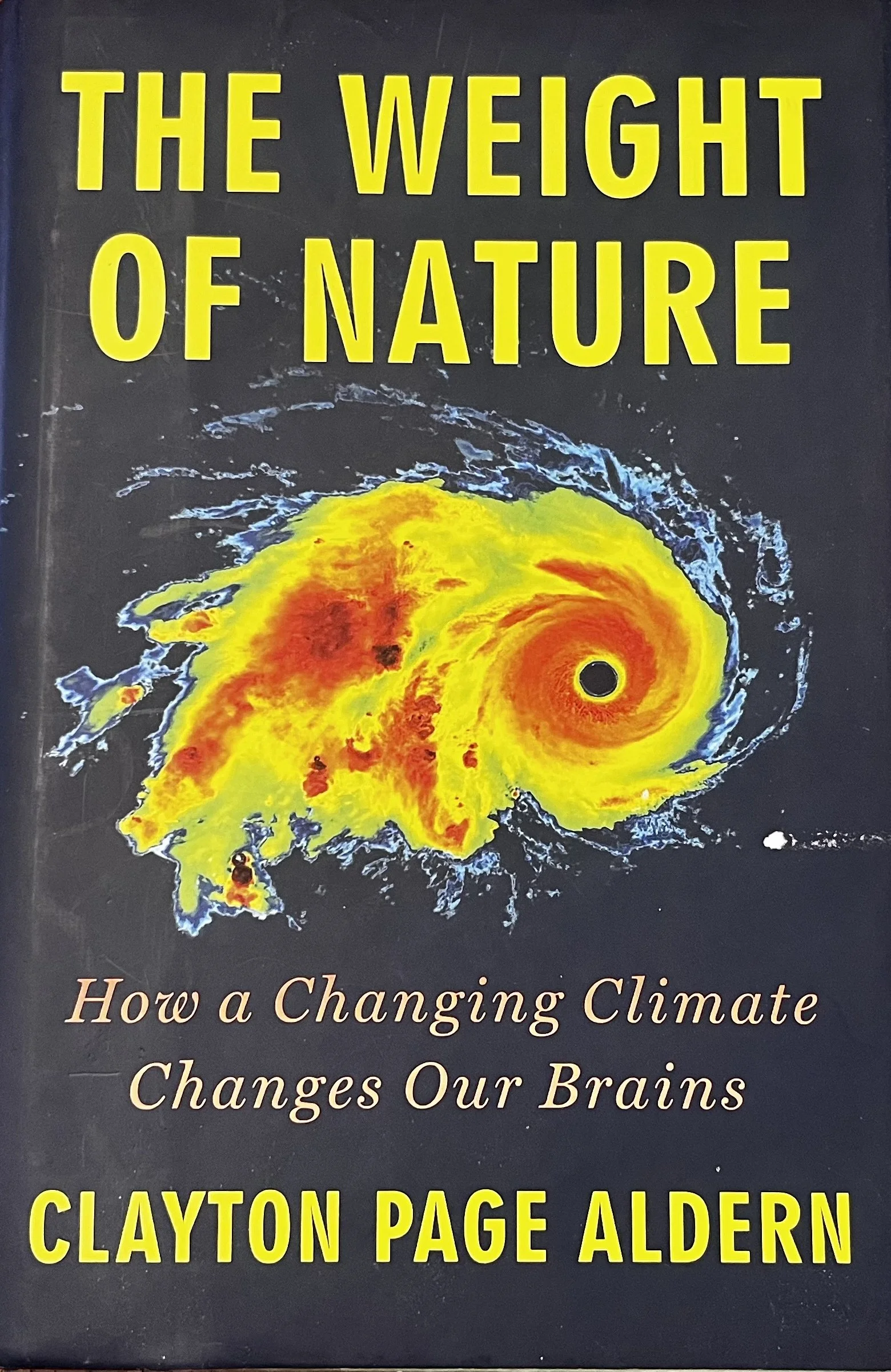 Book cover titled 'The Weight of Nature' by Clayton Page Aldern, featuring a weather map or satellite image of a cyclone or hurricane.