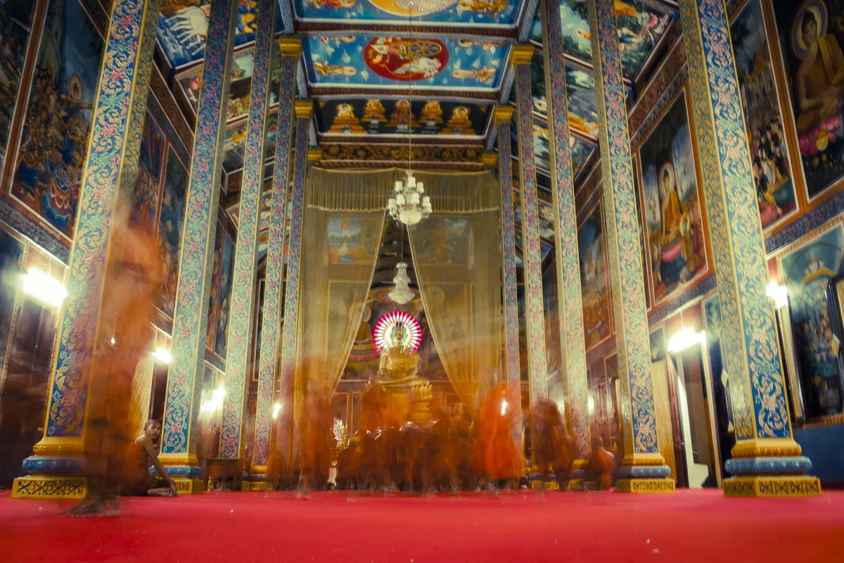 Monks leaving temple after evening chants
