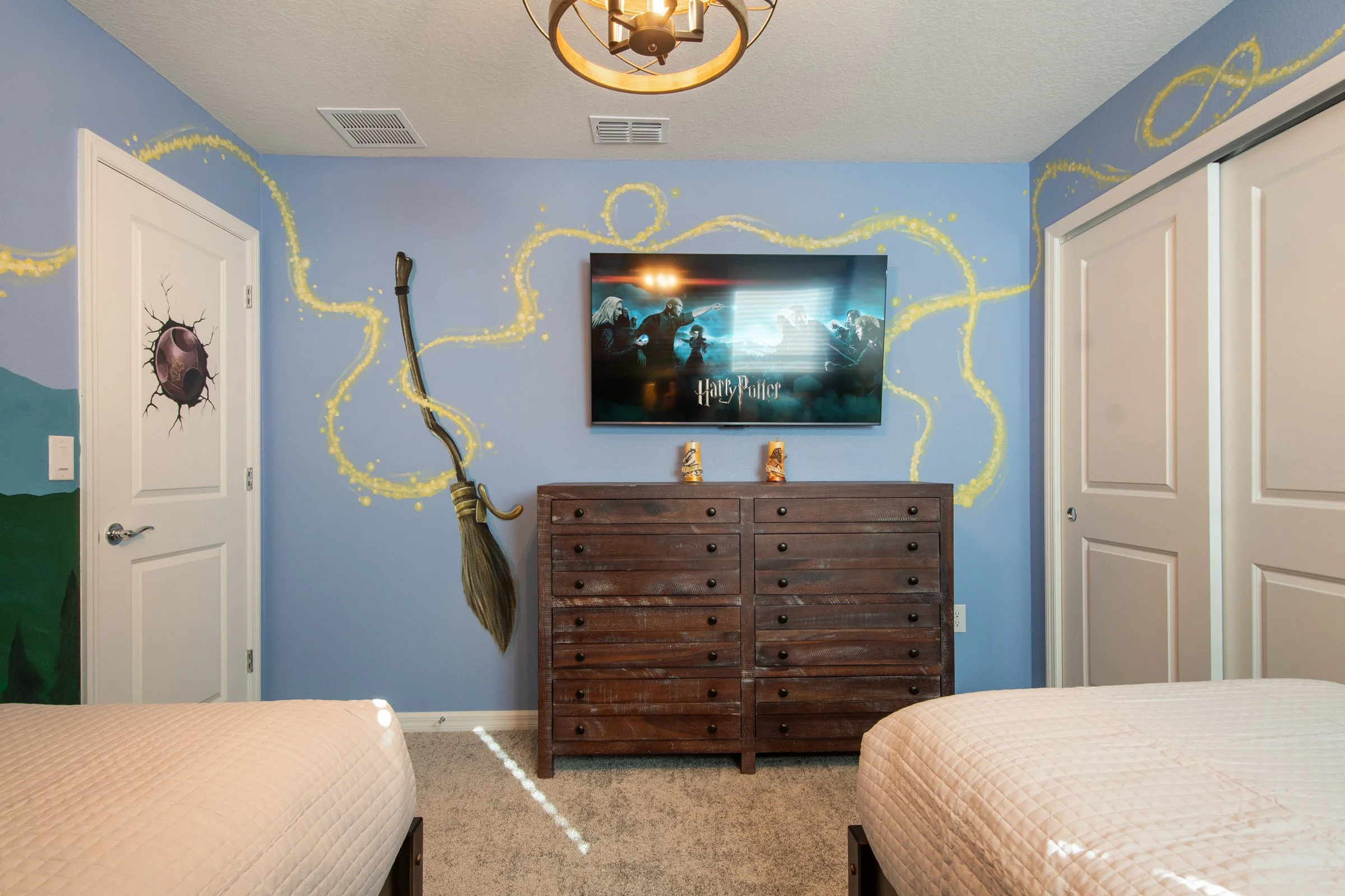 Luxury private villa in Windsor Cay Resort near Orlando, Disney, and Universal Studios. Harry Potter themed bedroom with twin beds, TVs in every bedroom, spacious living, 10-bedroom, 8-bath home with private pool and spa.